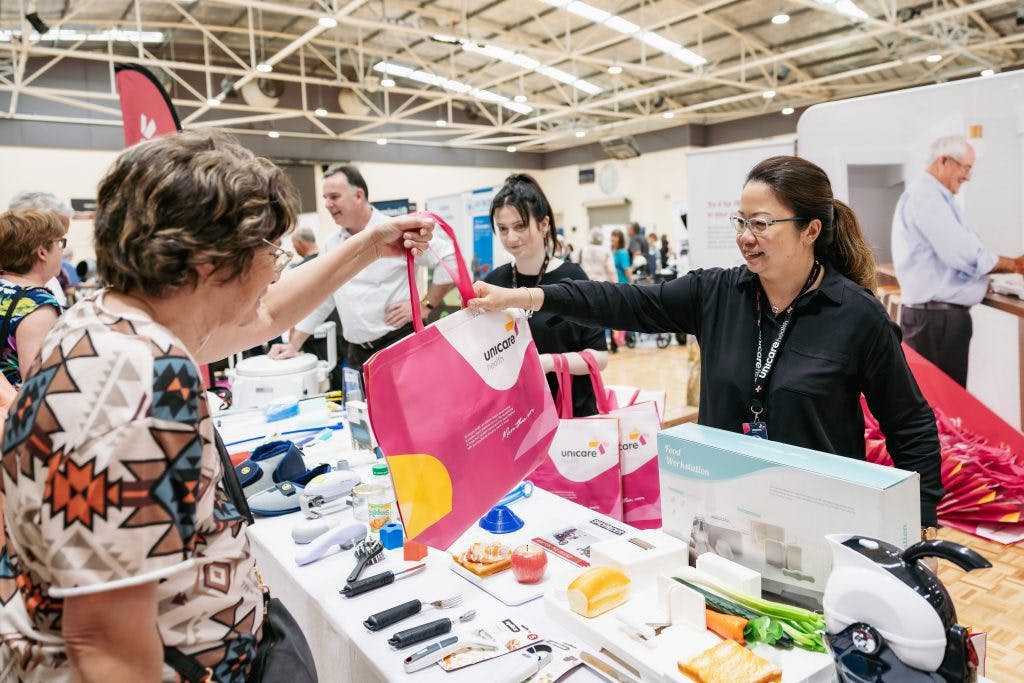 Seniors learn about independent daily living aids from Unicare Health at Rockingham Seniors and Carers Expo 2023