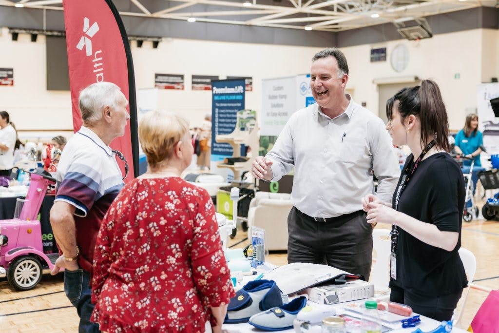 Seniors discuss assistive technology and independent living aids with Unicare Health at Rockingham Seniors and Carers Expo 2023