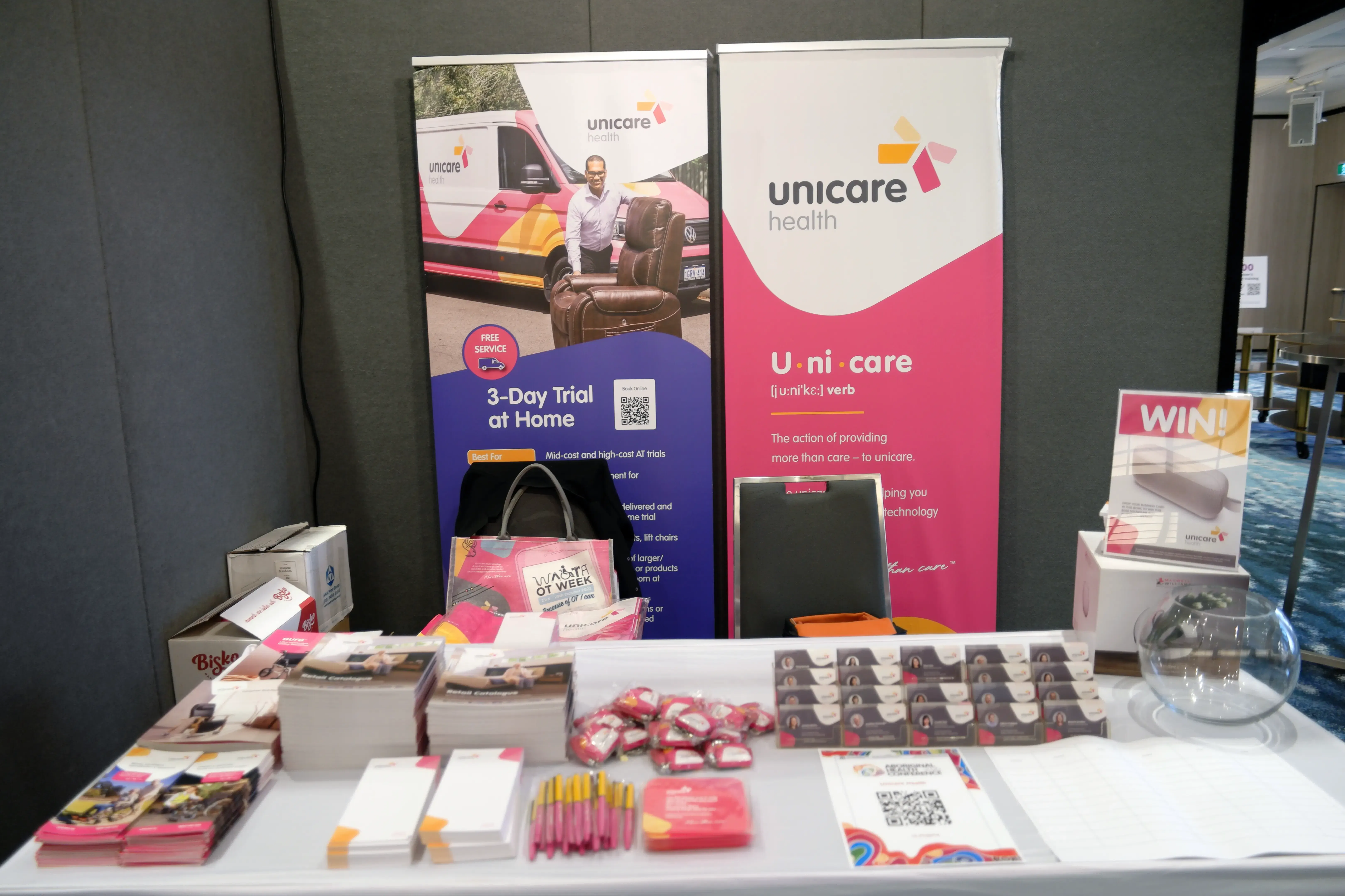 The Unicare Health exhibition stand displaying assistive technology product information at the Aboriginal Health Conference 2026 in Perth.