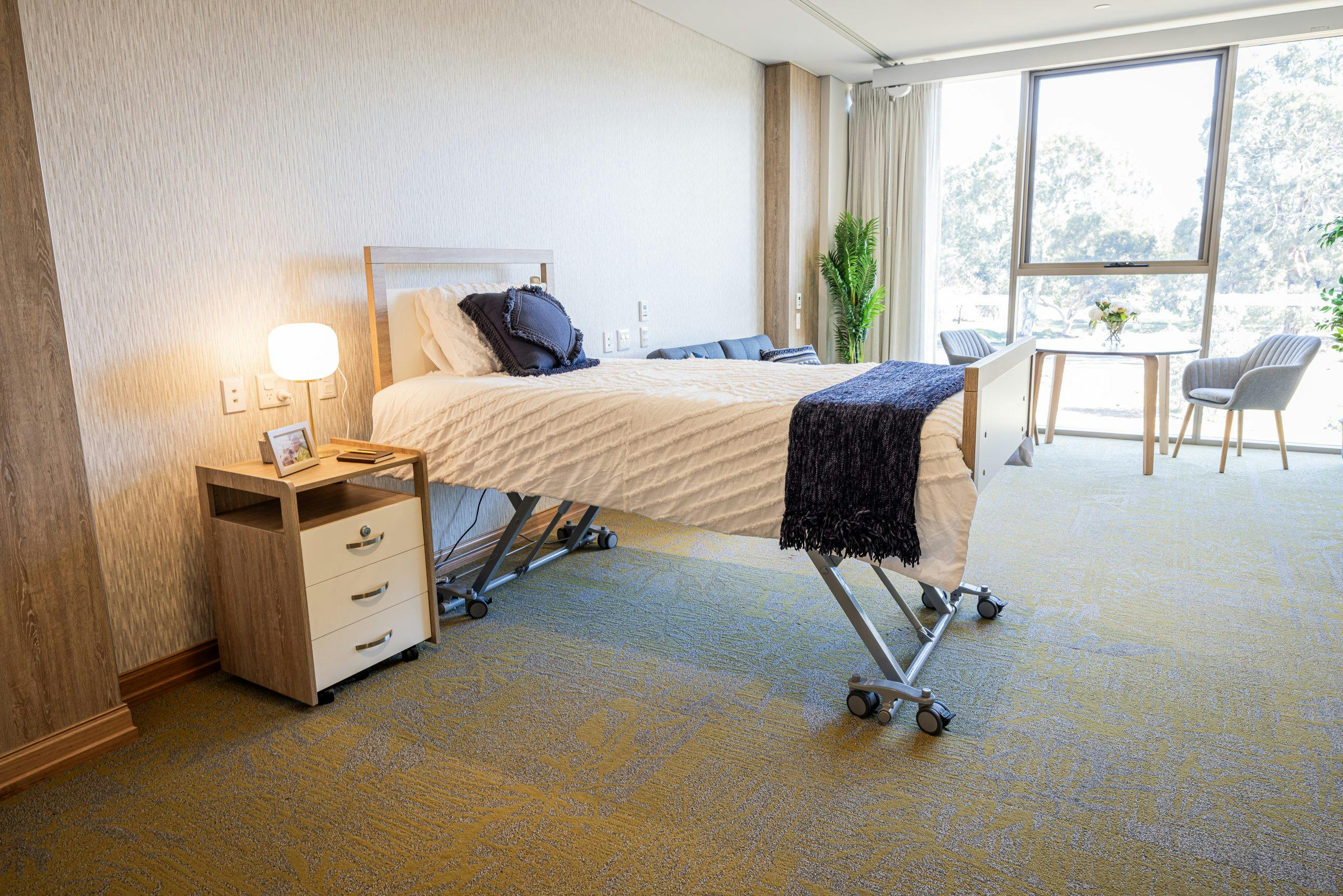 Unicare Health xcel bed raised to maximum height in Middle Swan Residential Care bedroom