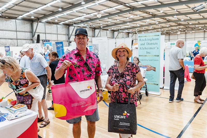 Seniors carry Unicare Health assistive technology showbags at Have A Go Day Rockingham 2023