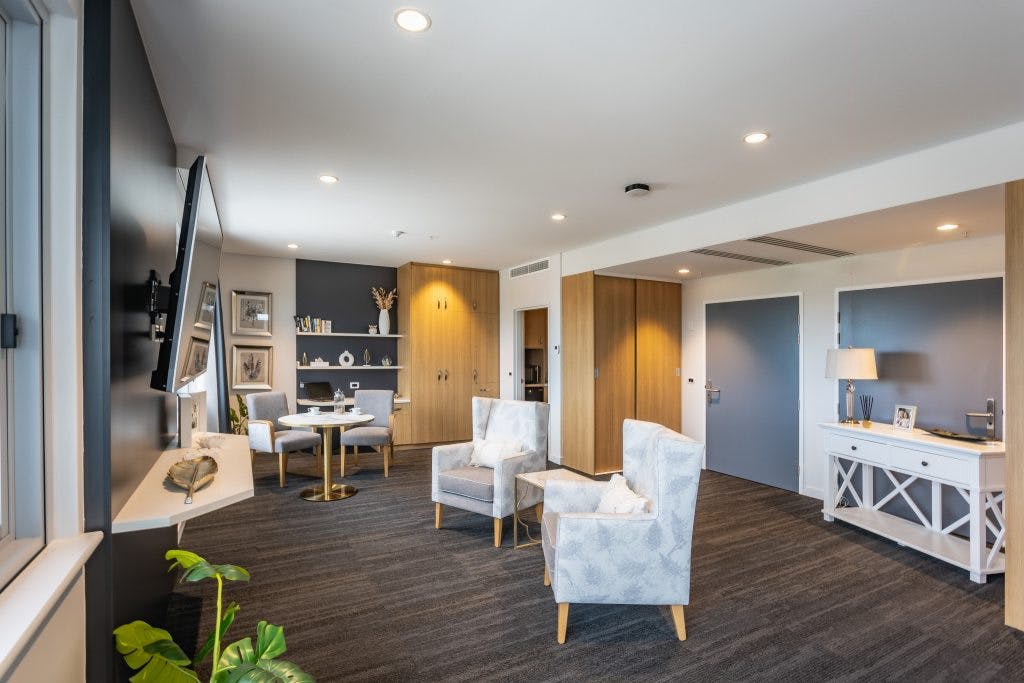 Chairs and tables in residential en-suite bedroom at Rosewood aged care