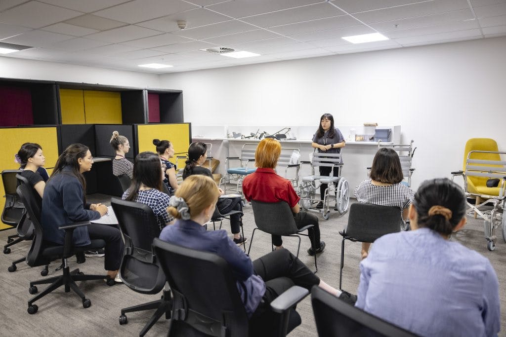 Occupational therapists learn about JUVOCare shower commodes at Unicare Health's free clinical training session in the Assustive Technology Collaboration Centre