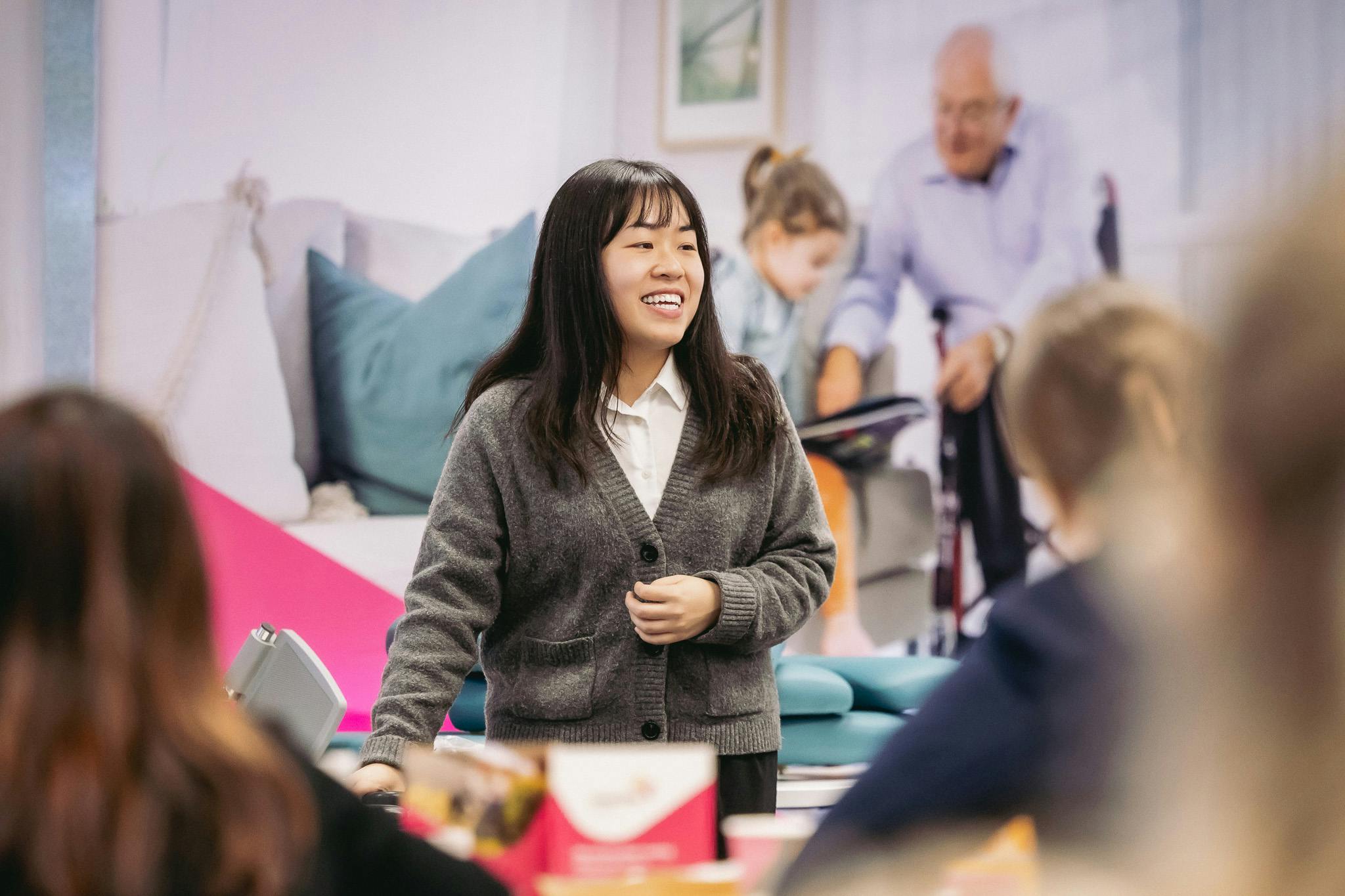 Clinical educator teaches occupational therapists shower commode prescription at Unicare Health workshop