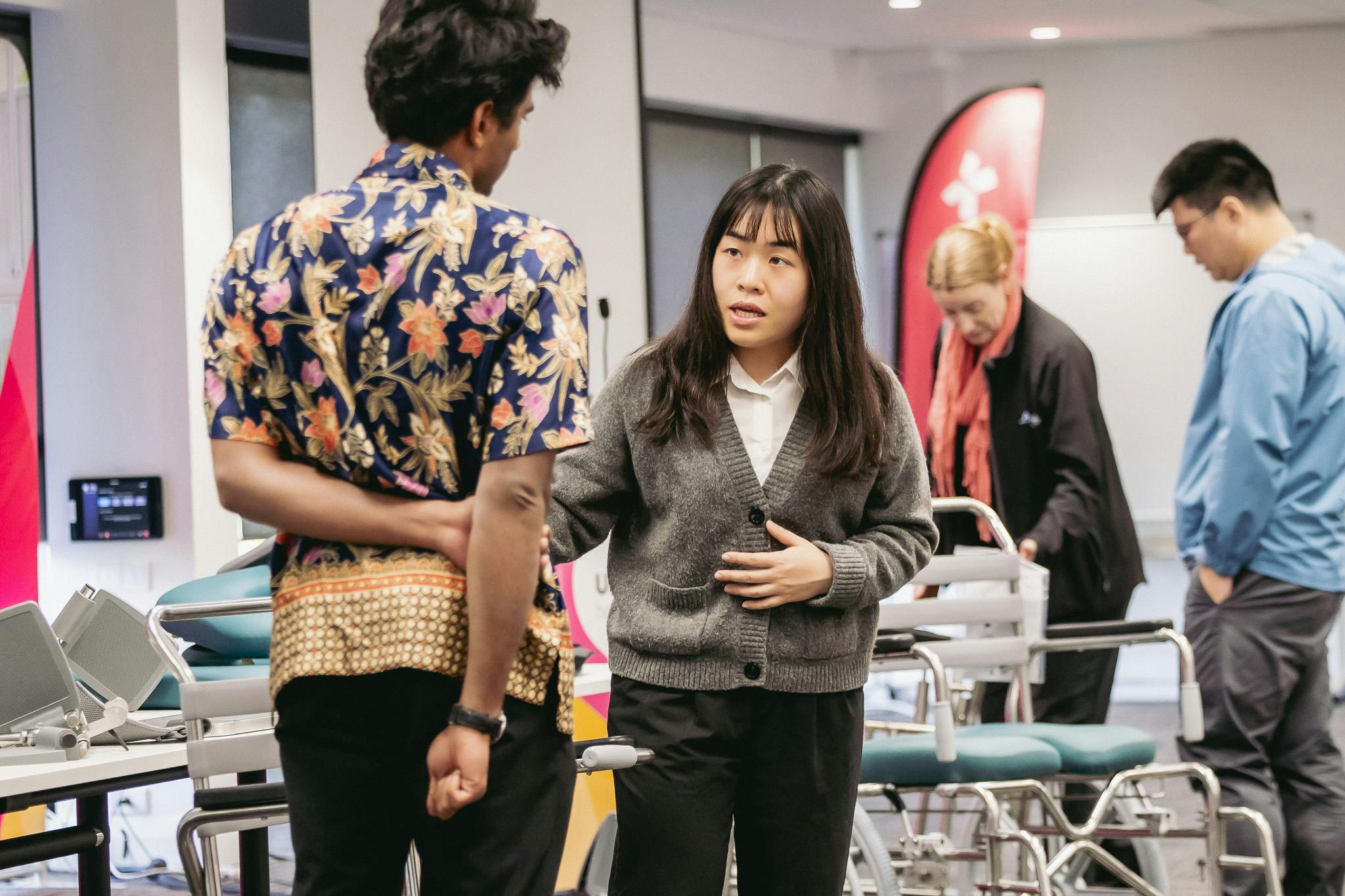 clinical educator discusses custom shower commode prescription with occupational therapist