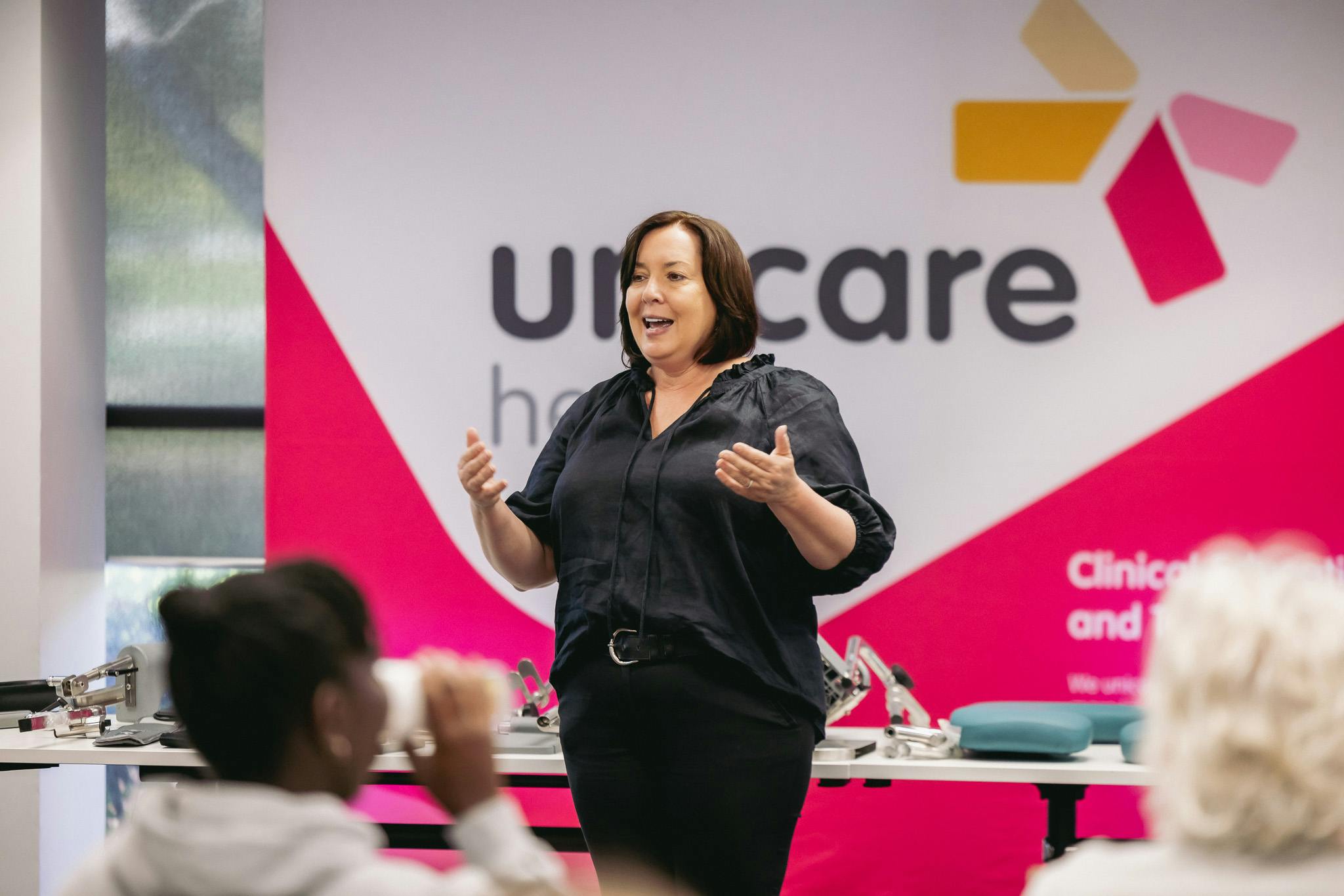 clinical educator leads shower commode prescription educational workshop for occupational therapists