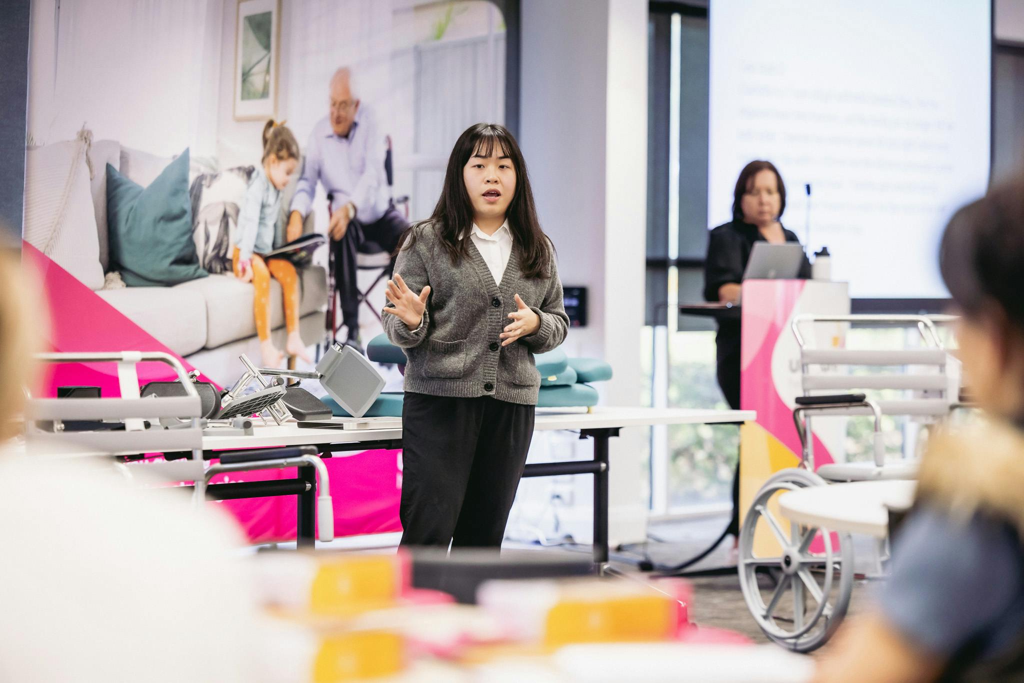 Unicare's shower commode subject matter expert Crystal Chan giving a presentation