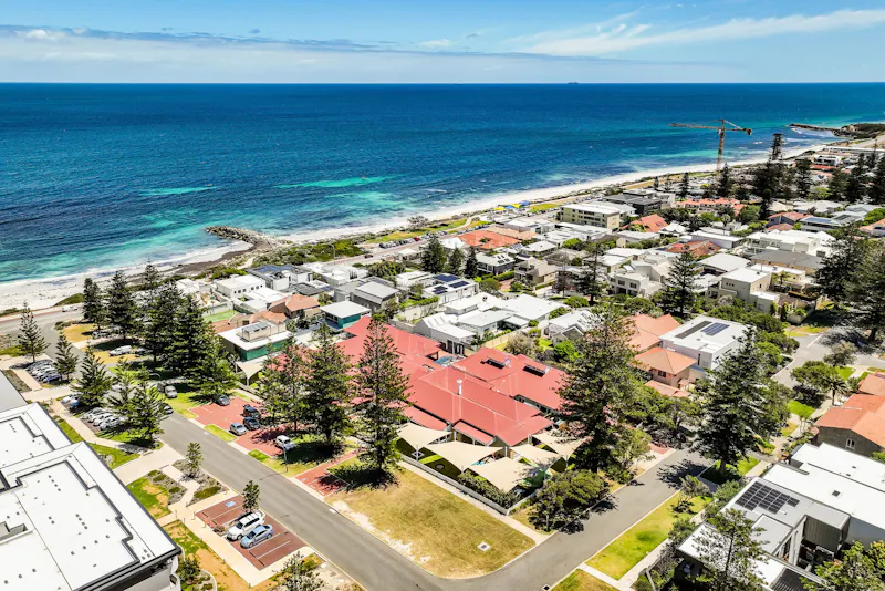 Aerial view of Cottesloe coastline in Perth showing Lady Lawley Cottage near the beach, accessible accommodation in a prime seaside location