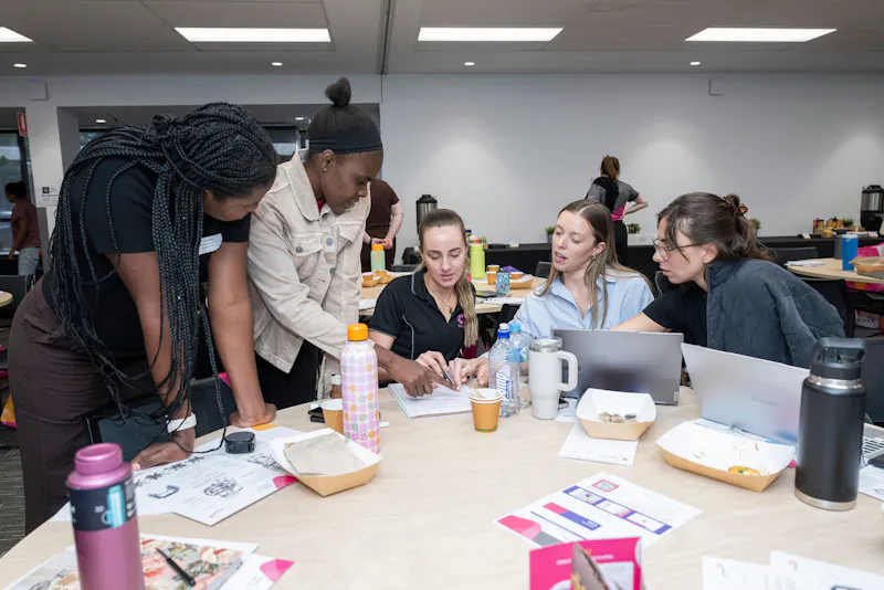 Occupational Therapists collaborating on case studies and clinical decision-making during Unicare Health bathroom mobility and home modifications training in Perth WA