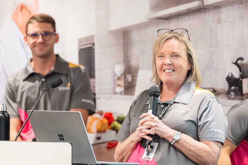 Jill from Unicare Health Support team speaking about equipment servicing and maintenance during bathroom mobility training workshop in Perth WA