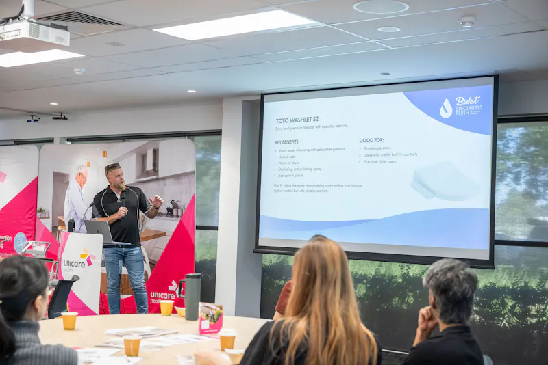 Michael Brown presenting bidet features and benefits for toileting independence during Unicare Health CPD training workshop in Perth WA