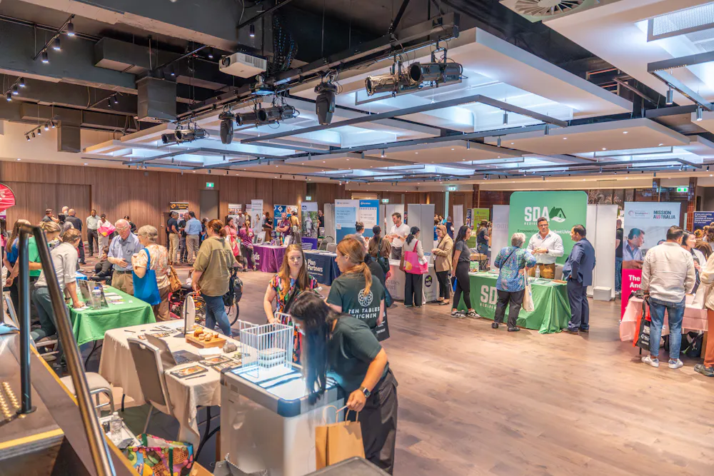 Crowd of attendees and disability providers at Bankstown Disability Expo NSW inside Canterbury League Club Belmore, showcasing local NDIS services and support stalls