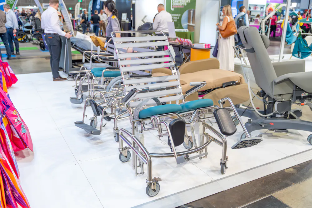 Shower commodes and clinical seating displayed at the Unicare Health stand during the ATSA Independent Living Expo Sydney 2026.