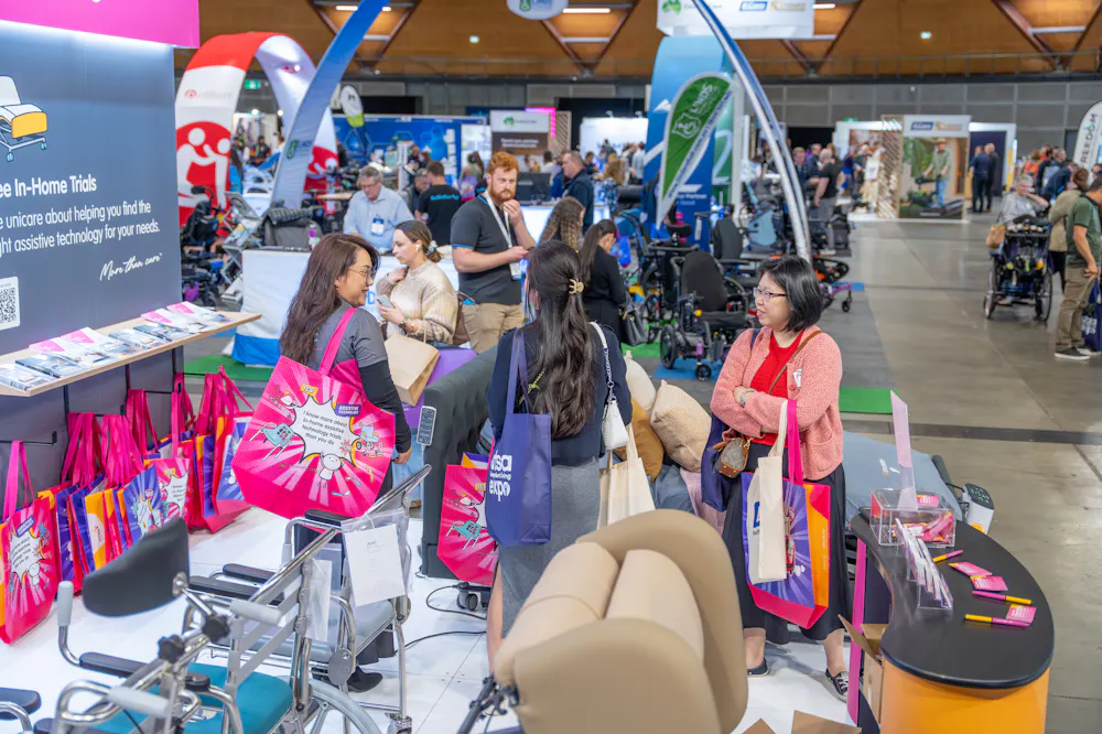 Visitors exploring the Unicare Health stand at the ATSA Independent Living Expo Sydney 2026.