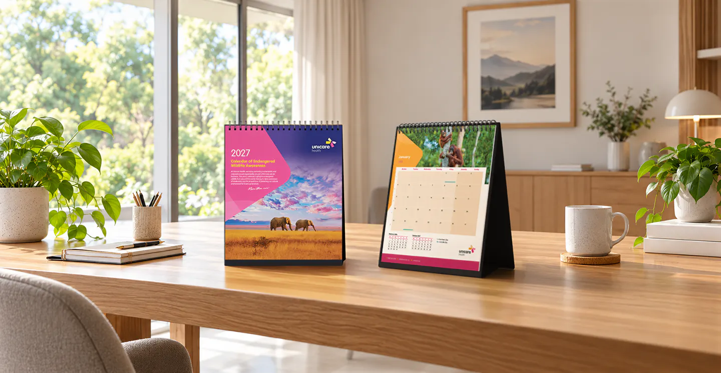 Unicare Health 2027 Endangered Wildlife Awareness calendar displayed on a wooden table, showing the calendar cover and January page with wildlife photography.