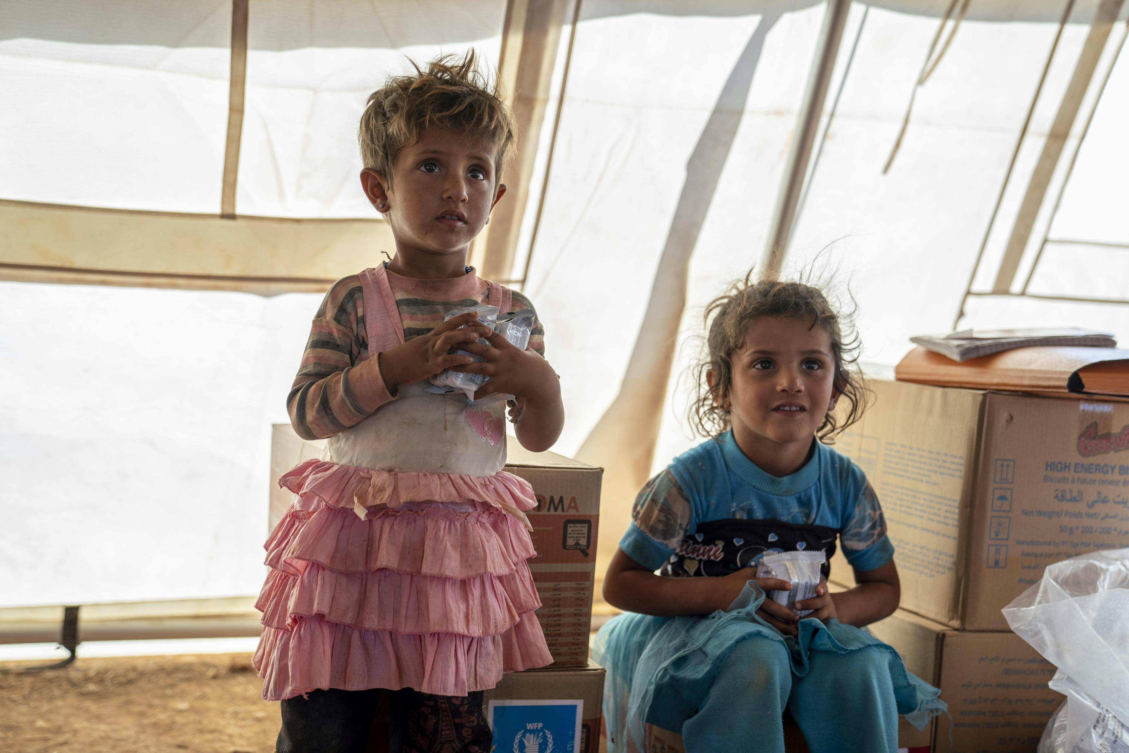 Nour, 2, and Asmaa, 4, (Outor’s eldest daughter) during a check-up at the UNICEF mobile health clinic.