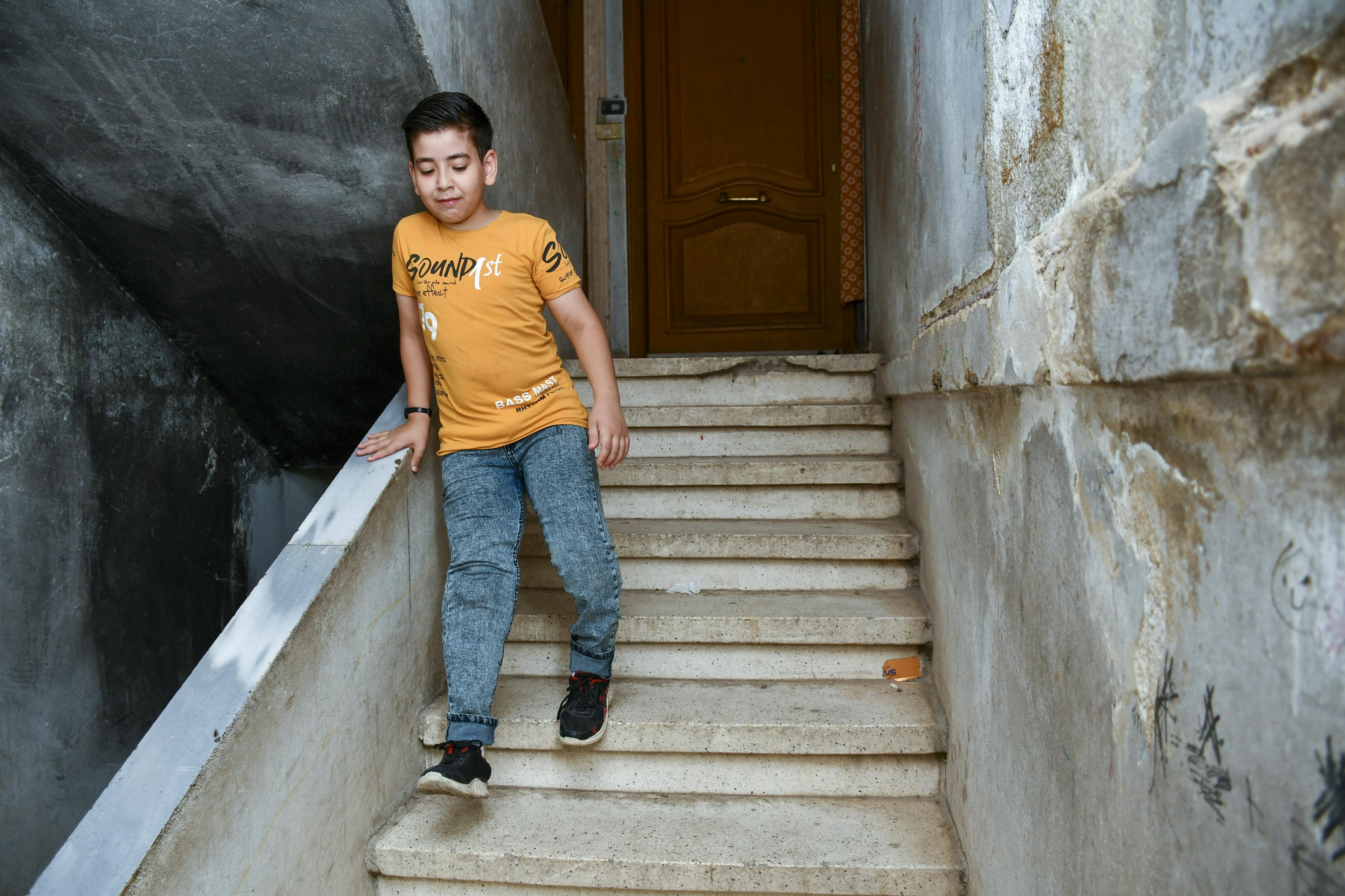 No longer in a wheelchair, Laith can now walk up and down the stairs of his home without assistance, thanks to receiving a prosthetic leg with the help of a UNICEF-supported programme.