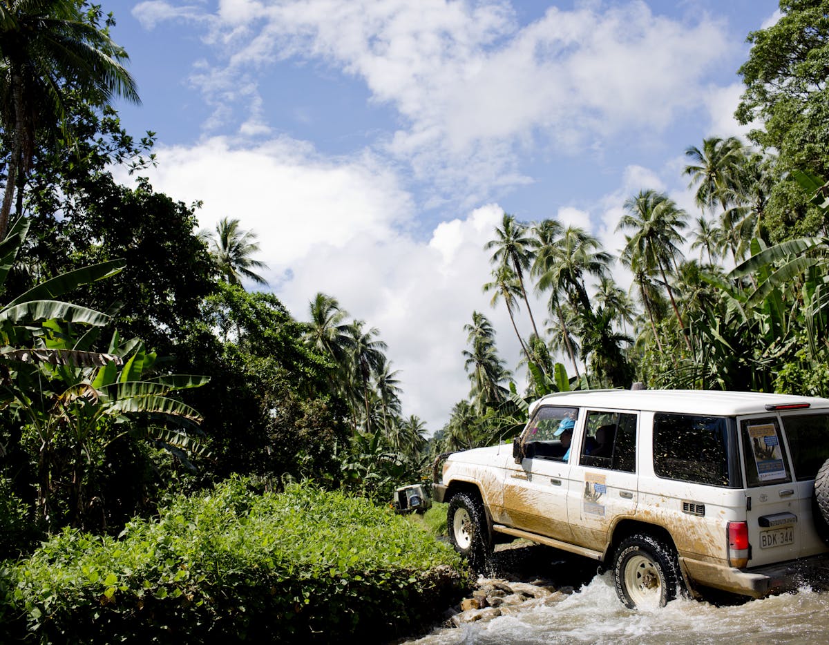 Immunisation - Driving through jungle to deliver polio vaccines in Papua New Guinea.