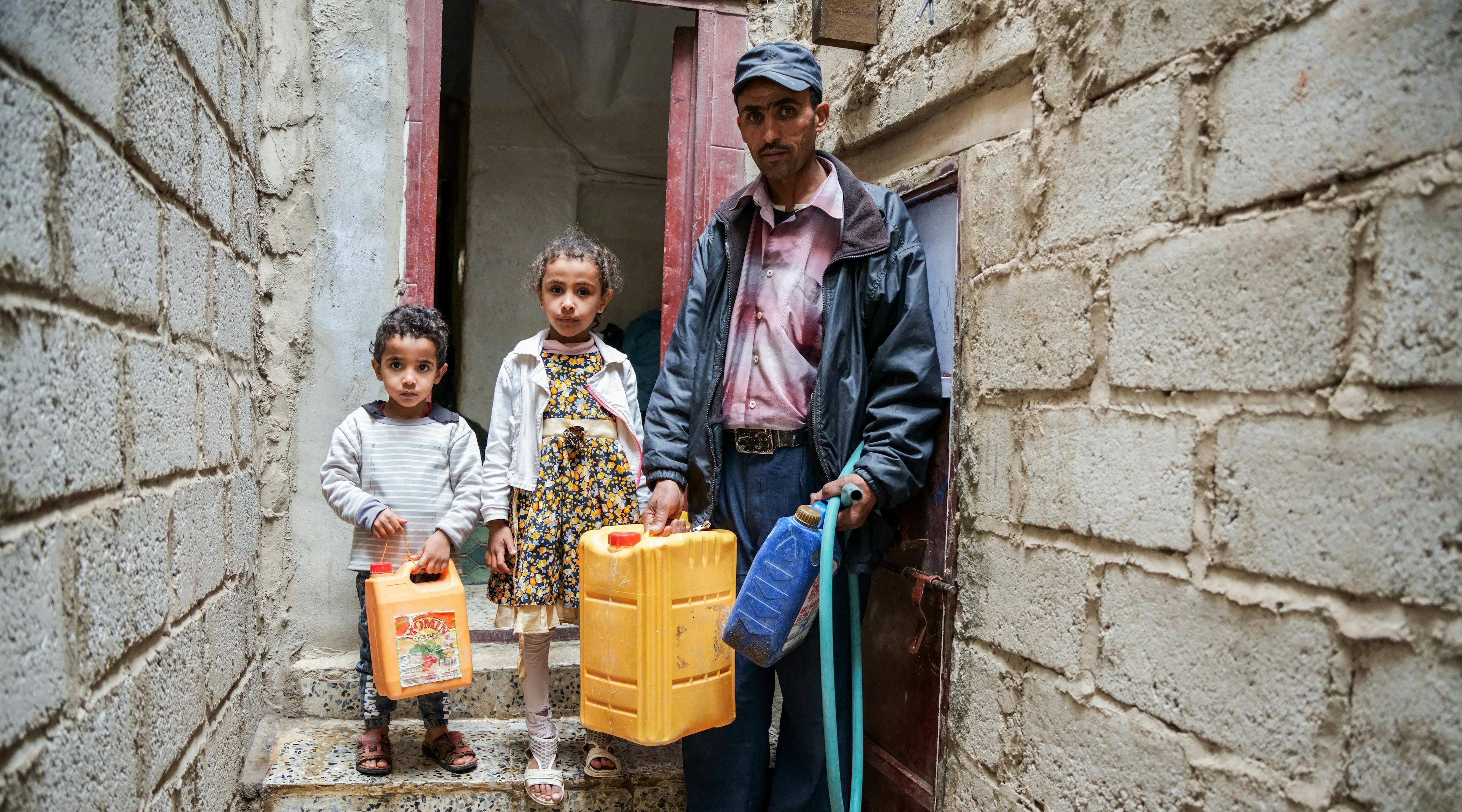 Nabil takes his children, Mayar, and Mohammed, to fetch water from a nearby charity tank in Dhamar Governorate, Yemen. This UNICEF-supported solar powered water project has provided clean water for 137,000 people including schools, health centres and vulnerable communities. This project is one of 150 solar powered water projects across Yemen, reaching 2.5 million people.