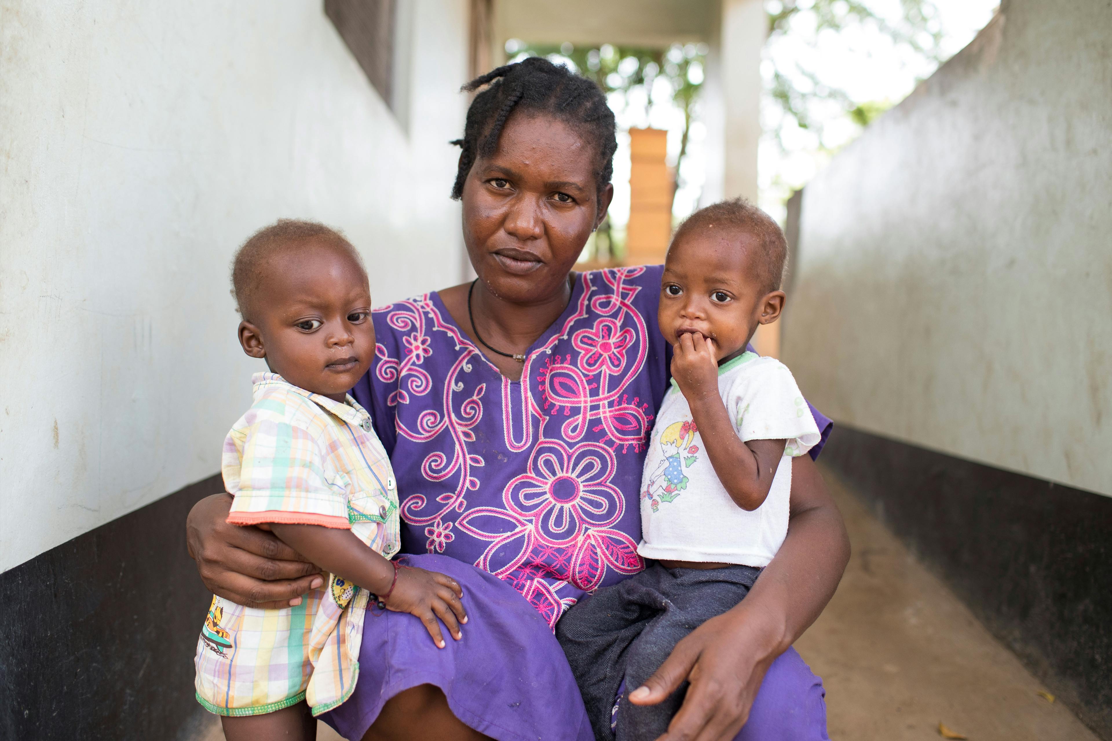 Juba, South Sudan, Julia Robert (37) with twins Wola (girl- malnourished, right) and Aladdin (boy), 15 months old at the ward for malnourished children of the Al Sabbah Childrens hospital in Juba, South Sudan. 