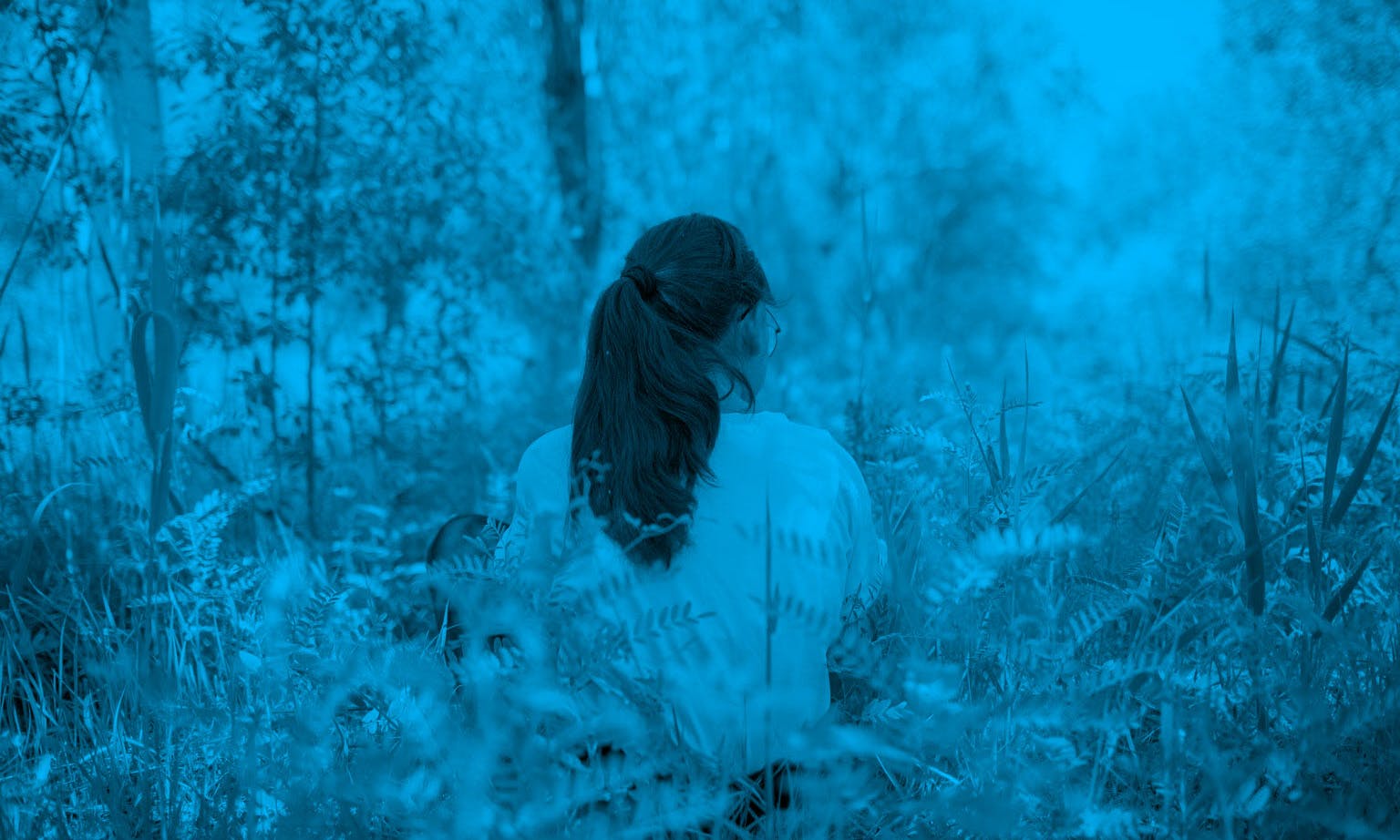 Ayim (13) sits in a park in Kazaly, Kazakhstan, while visiting with her mother, Zhadyra.