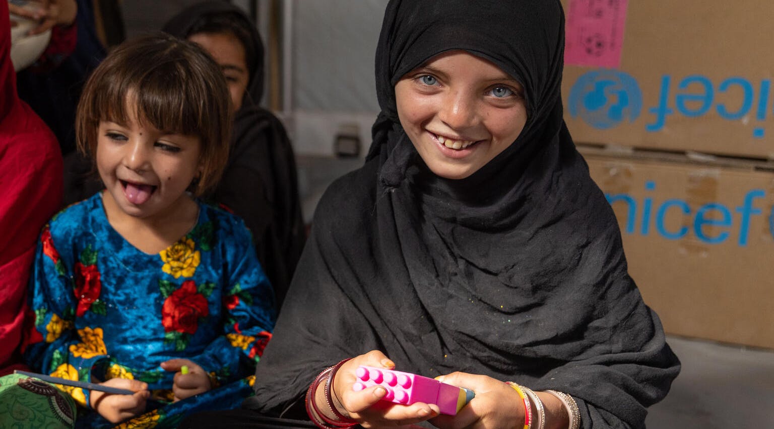 Afghanistan Emergency, Naghma, 7, plays with toys inside the child-friendly space where she attends daily with her friends.