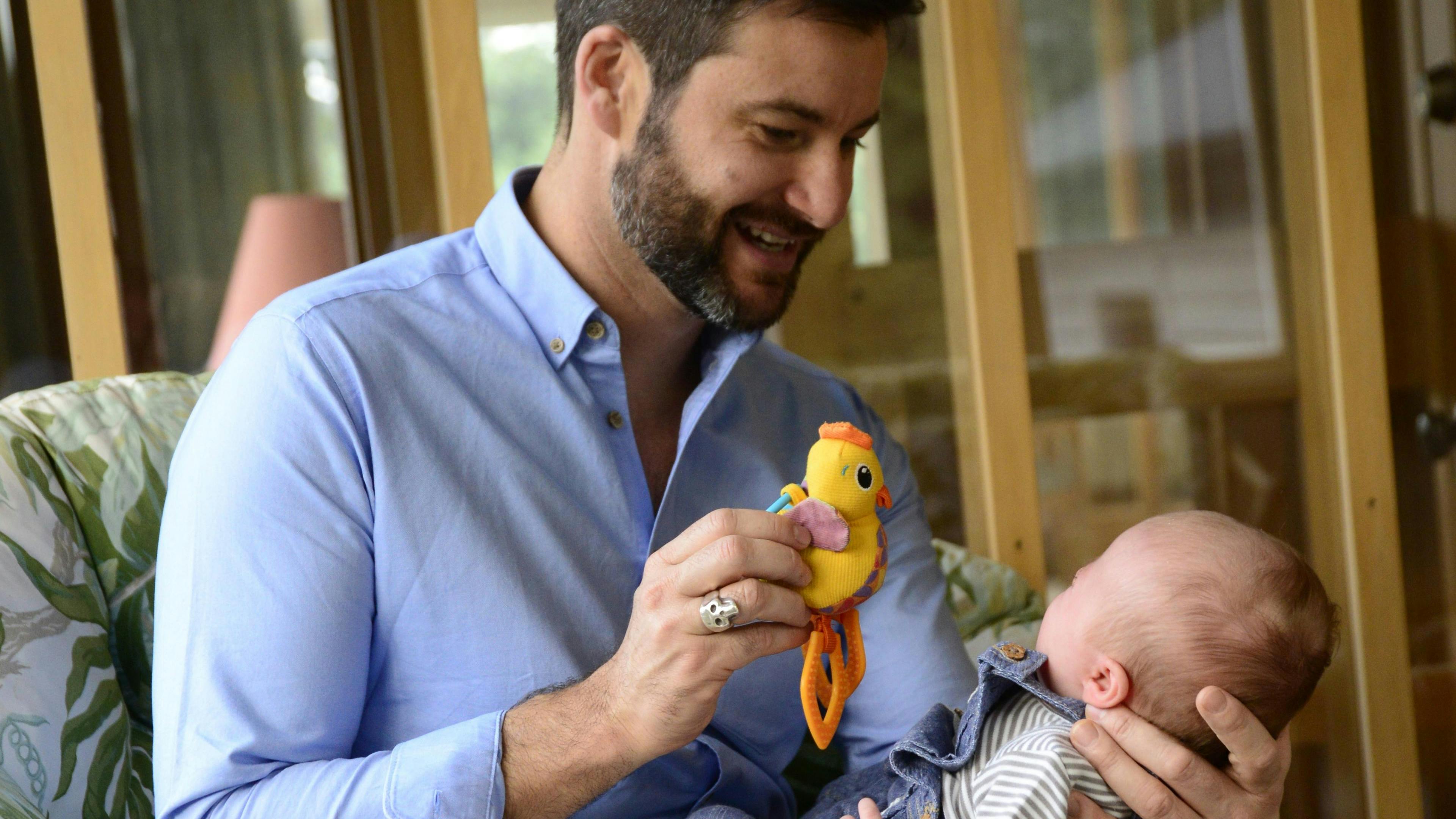 Clarke Gayford playing with baby Neve
