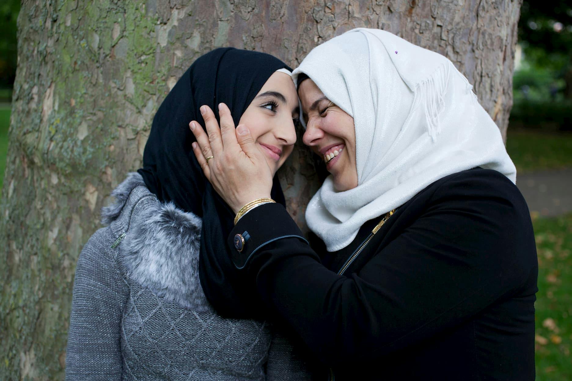 Hind and her daughter Nabila, 13, relax in a London park