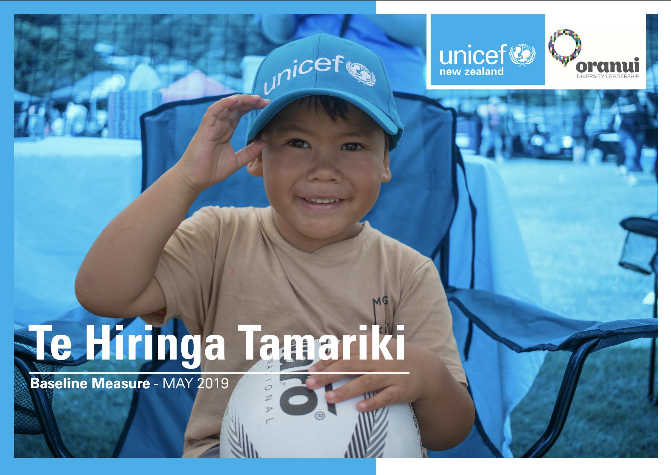 A young Maori boy smiles at the camera while wearing a UNICEF branded shirt for the Te Hiringa Tamariki Baseline Measure report in May 2019