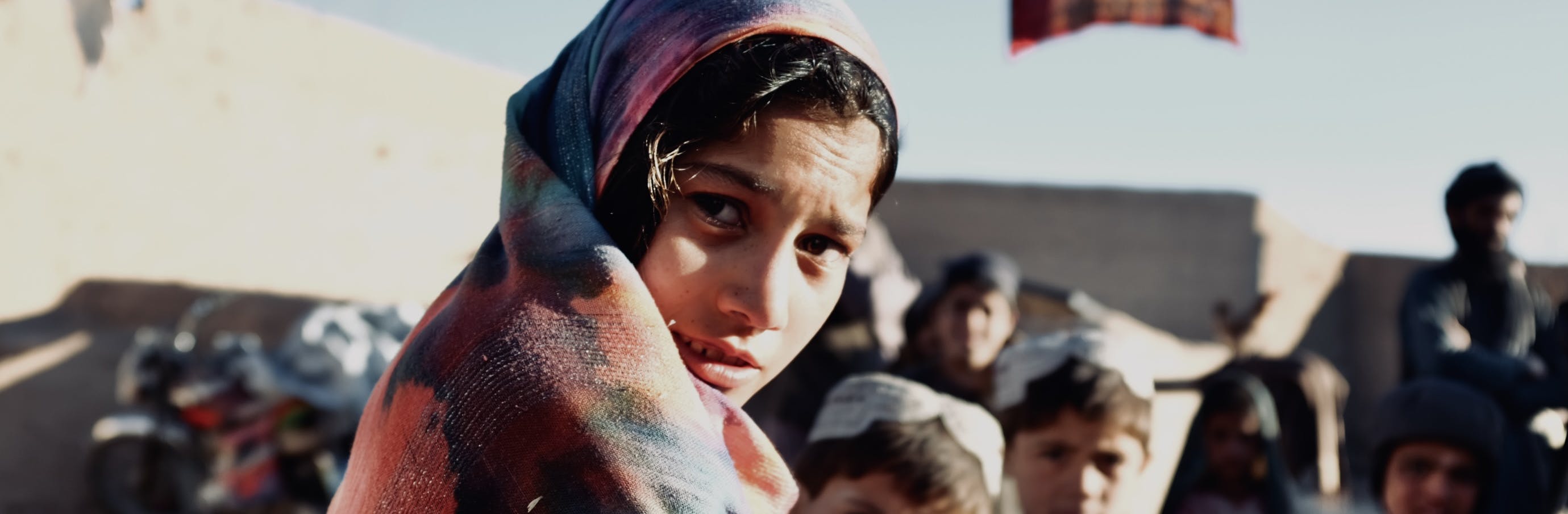 10 year old Peri-Gul inside a communal housing unit where latrines are being built in Sola Village, Tarinkot District.