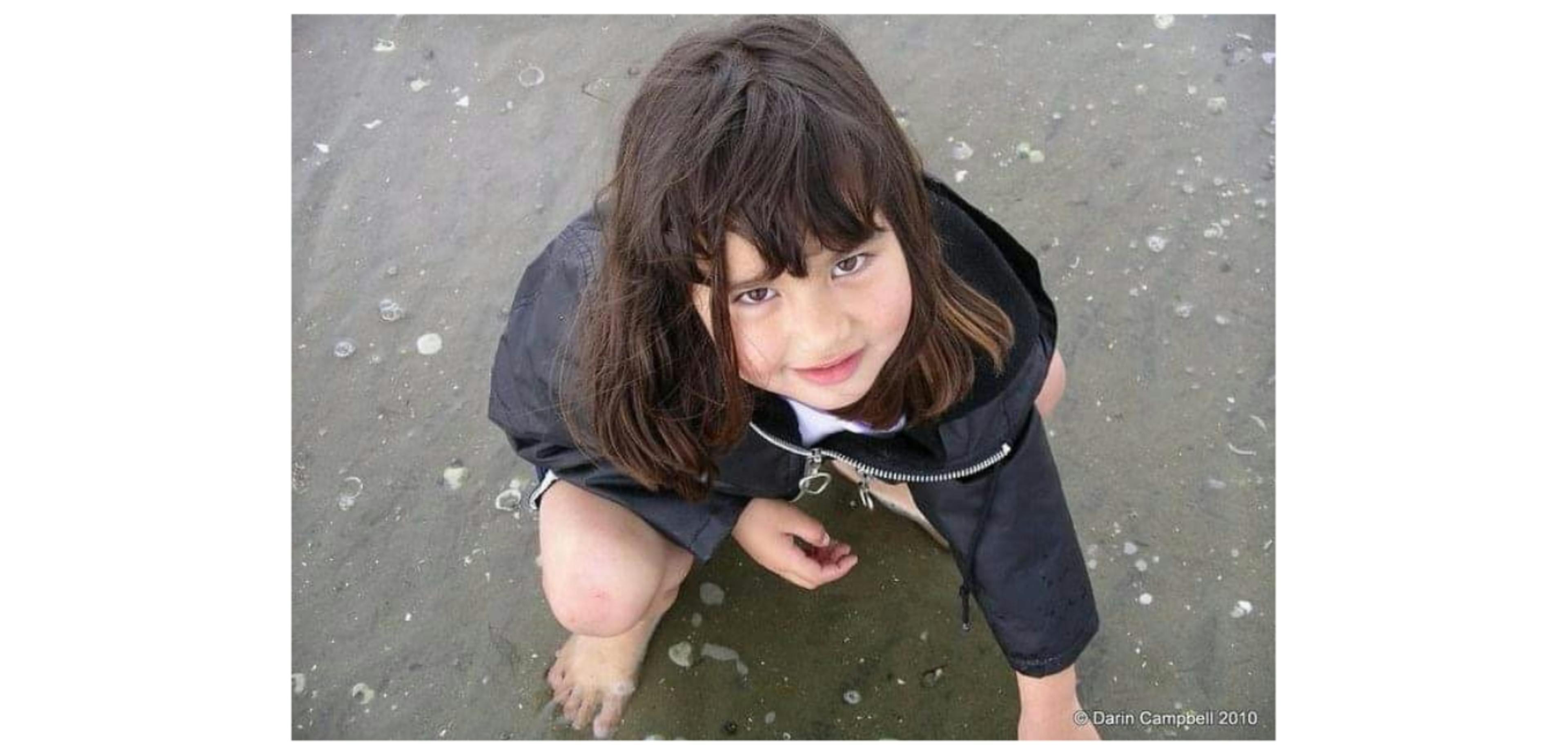 Paige Tapara as a young girl at the beach