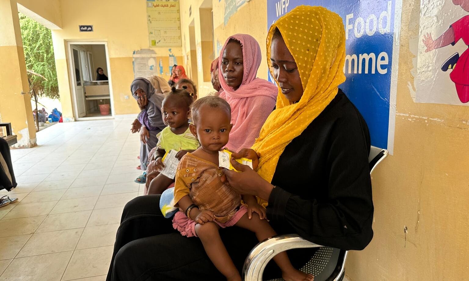 Mothers feed their children with ready-to-use therapeutic food in Sudan
