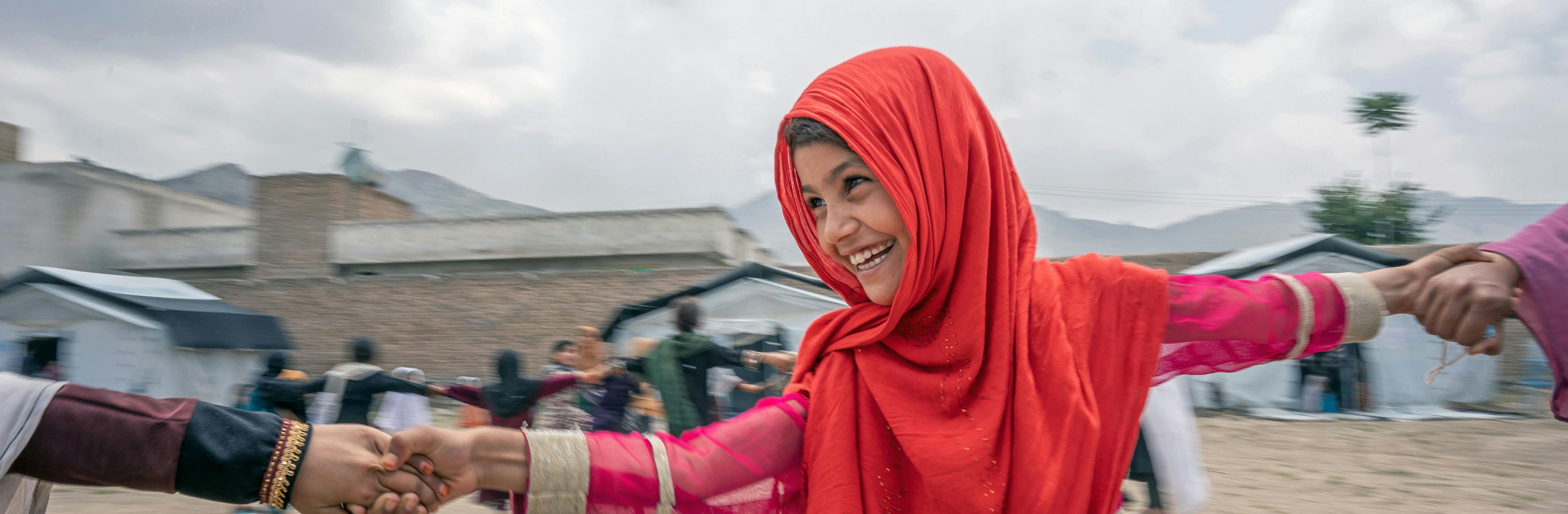 On 7th July 2022, girls play during breaktime at a UNICEF-supported community-based education centre in Hijrat Mina in Bagrami District, Kabul Province, Afghanistan.