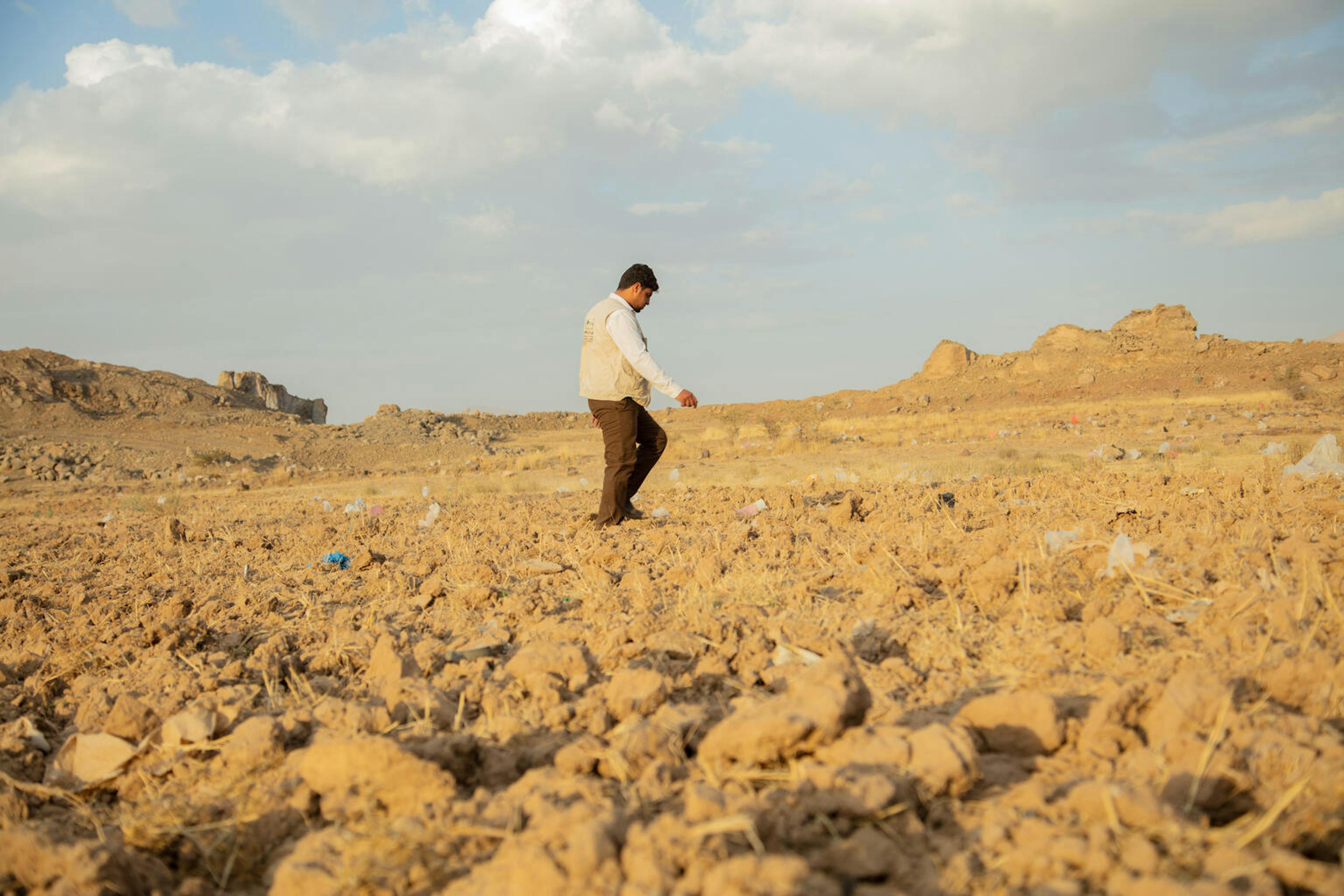 Mohammed Hasan, head of the maintenance and operation department, is seen walking near the corporation's reservoir two in Dhamar Governorate, Yemen.