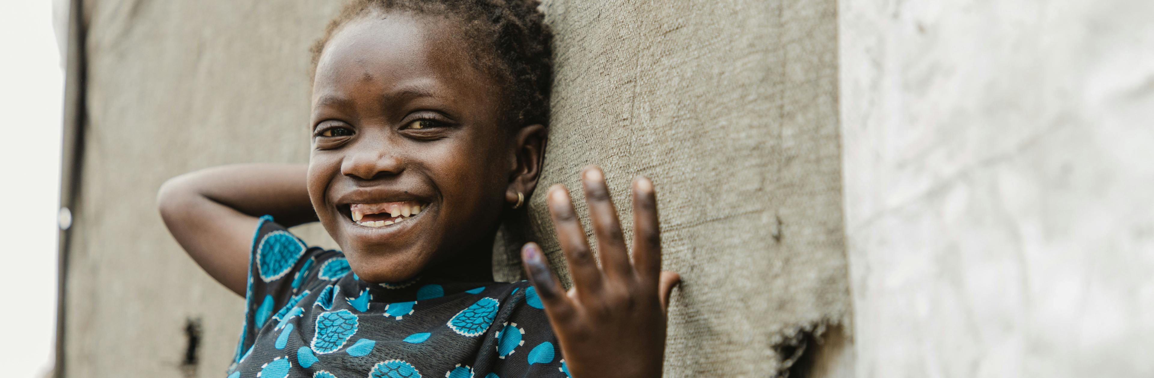 Pascaline, 3, shows her marked finger after being vaccinated against polio at the Bulengo site for displaced persons in Goma, North Kivu, DR Congo, August 11, 2023.  UNICEF is supporting a large-scale vaccination campaign to protect more than 23 million children across the country.
