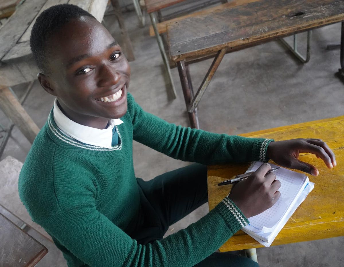 Mike studies in grade 12 at Katiula Combined School, in Katete, Zambia. “We used to bring our own torches to schools for evening classes, but the light was never enough and only lit the corners of the classroom,”