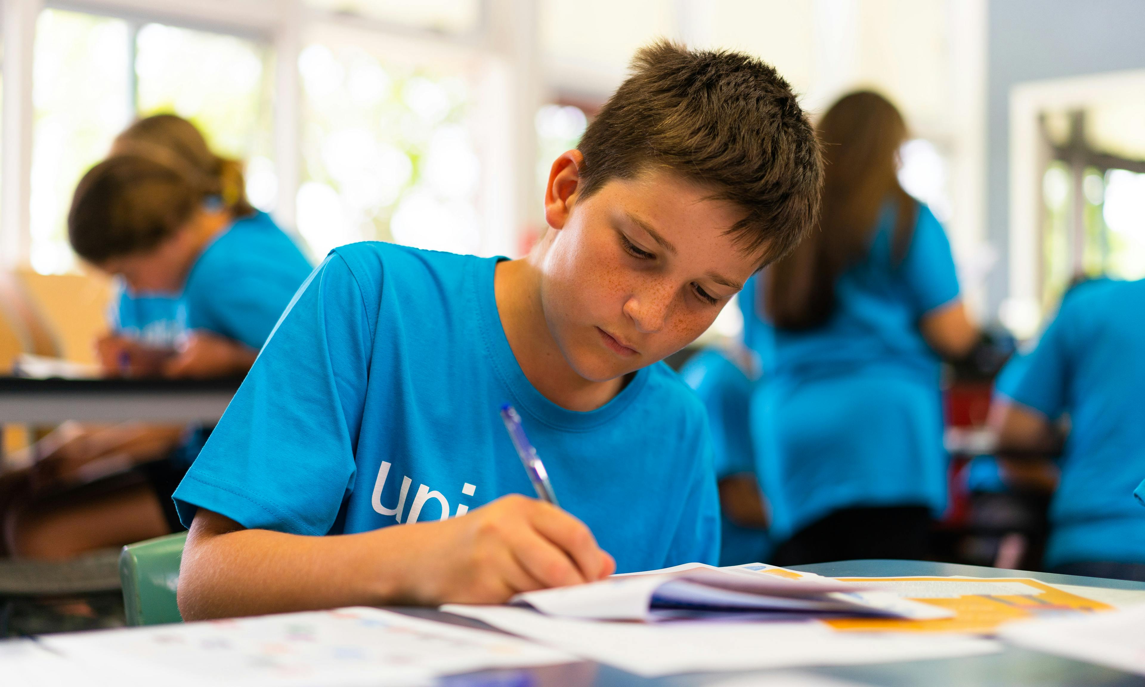 A school boy in New Zealand learning about his rights on World Children's Day.