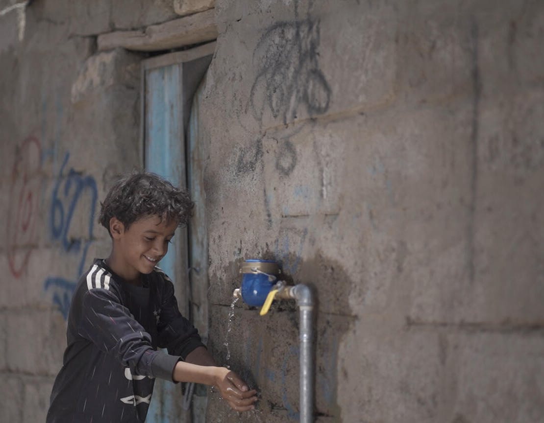 A young boy washes his hands at one of the taps installed as part of UNICEF's WASH projects in Marib city, Yemen.