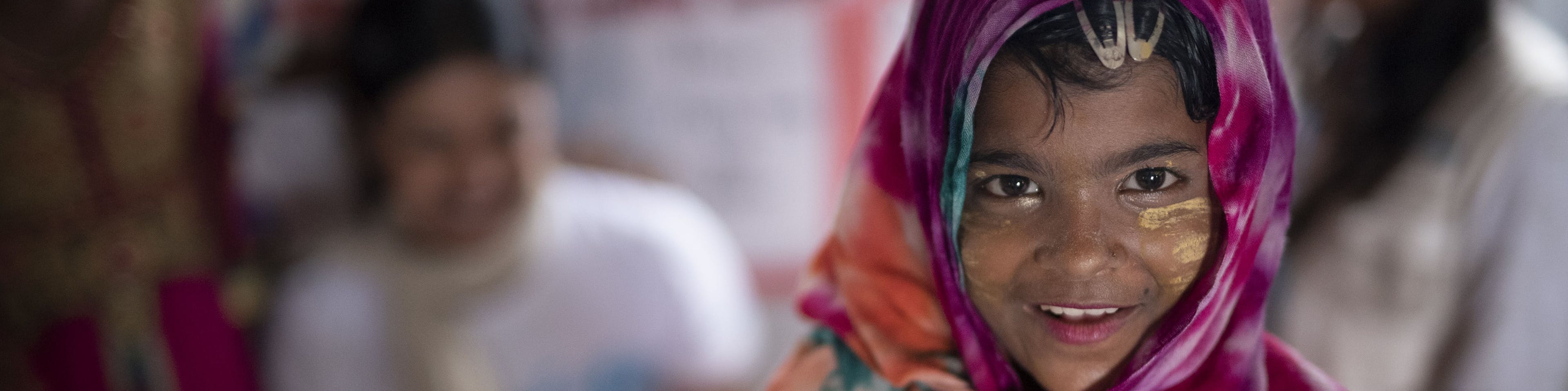 A Rohingya refugee child smiles in Balukhali camp, Cox's Bazar district, Bangladesh