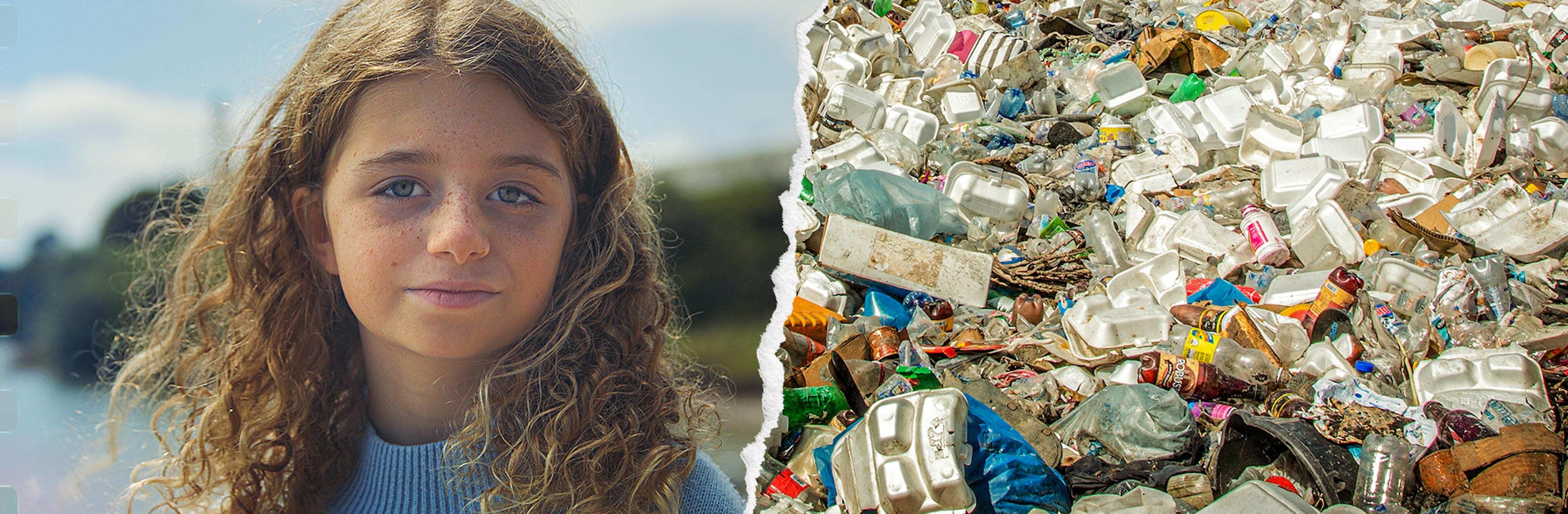 Young girls looks straight ahead with piles of trash on the other side