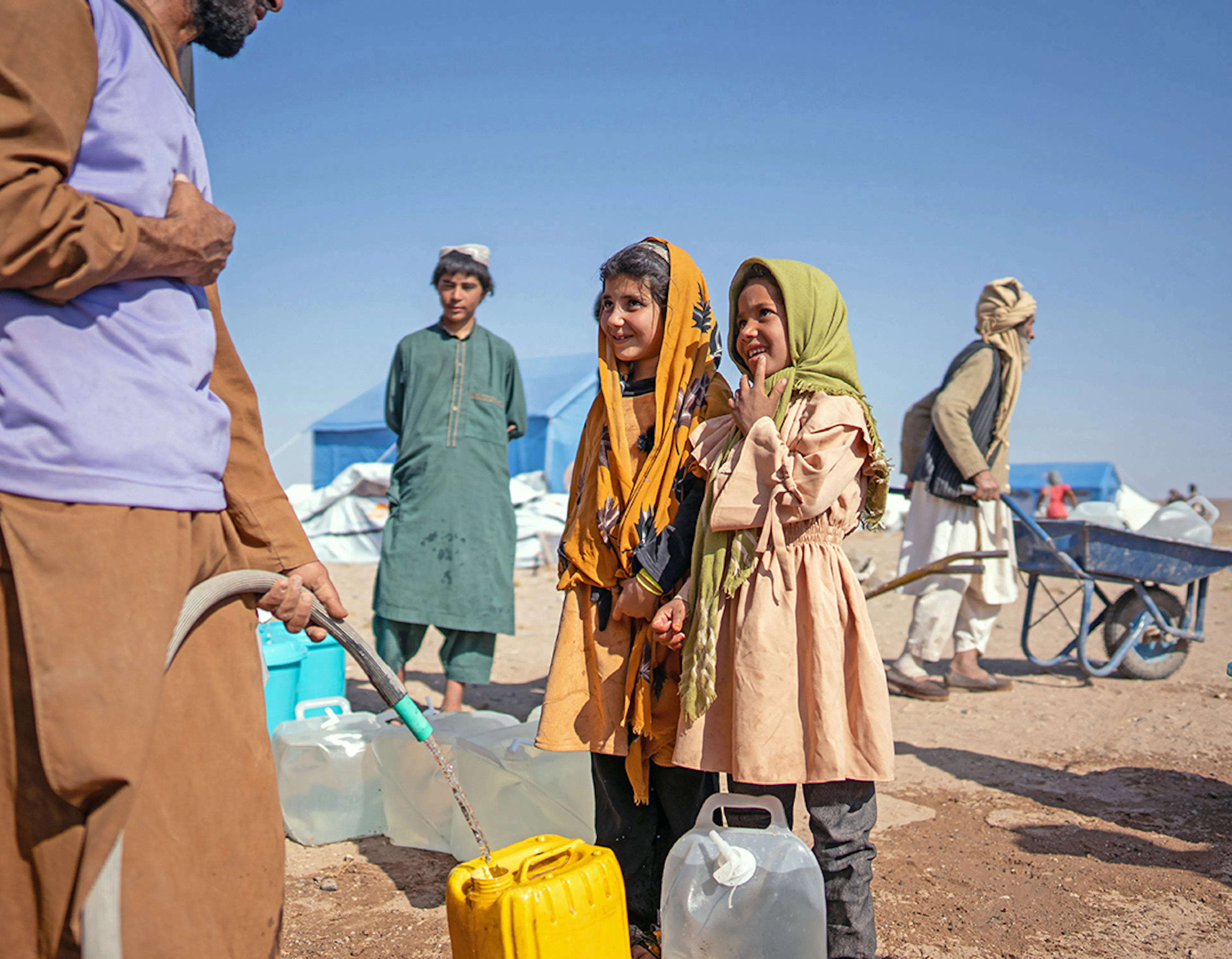 On 11th October 2023, survivors of the recent earthquakes receive safe water from a UNICEF-supported truck in Seyaab, Zinda Jan District, western Afghanistan.