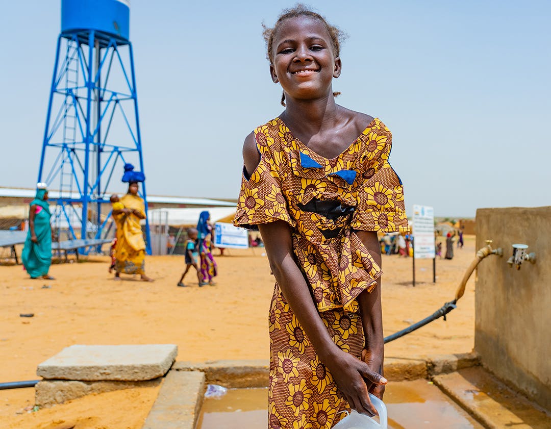 Anema walet Aboubacrine, takes water from the fountain at the Bawa internally displaced persons site. Nearly 3,000 displaced people, more than half of whom are children, have fled violence, conflict and/or food insecurity to find refuge at this Bawa IDP site.