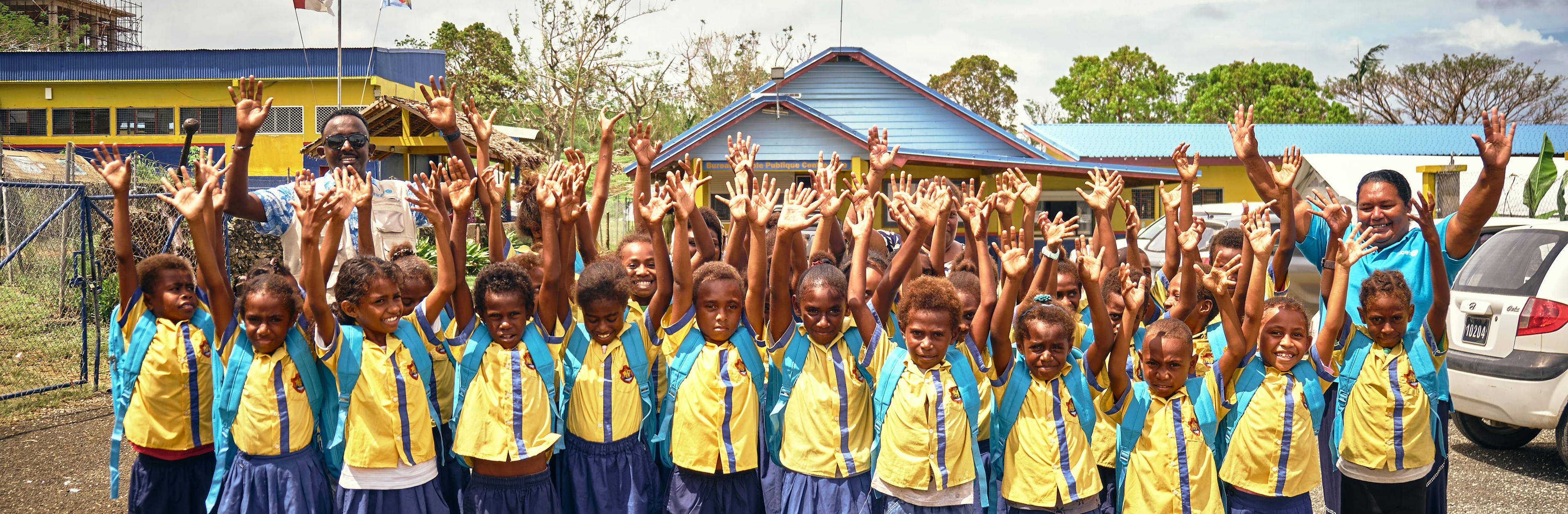 Children with their hands up