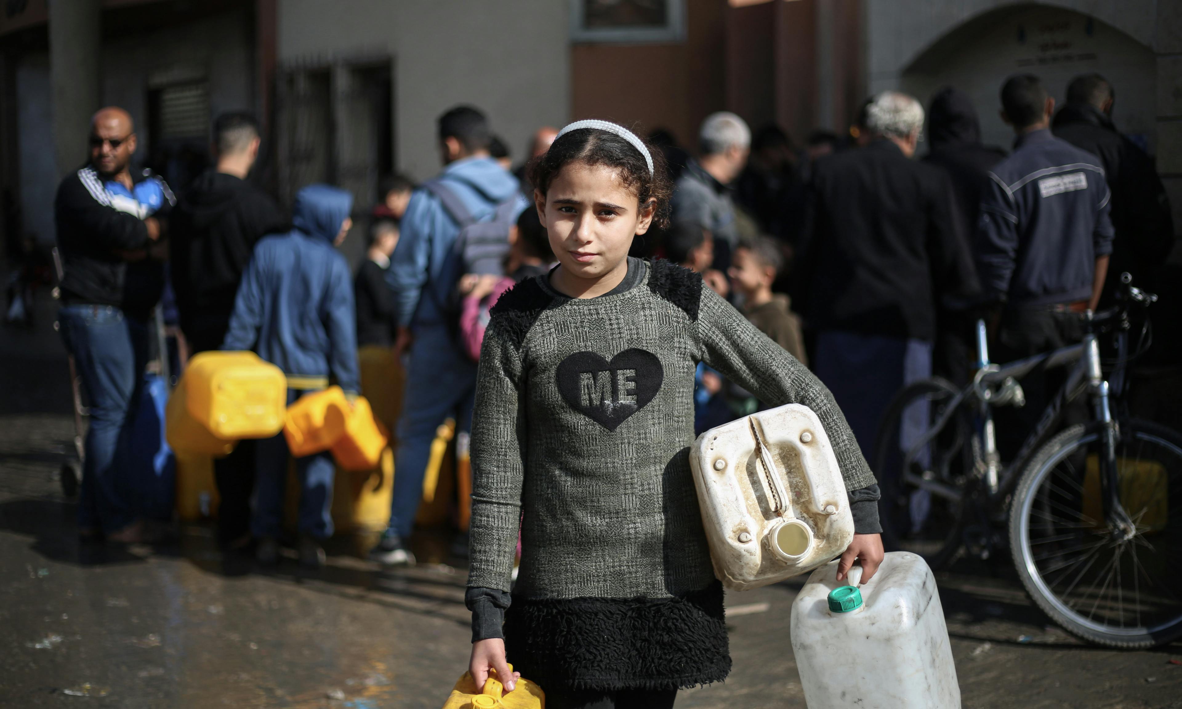 11-year-old Taline, was forced to leave her home in Khan Younis due to the hostilities. Every day she stands in a line to collect water for her family.