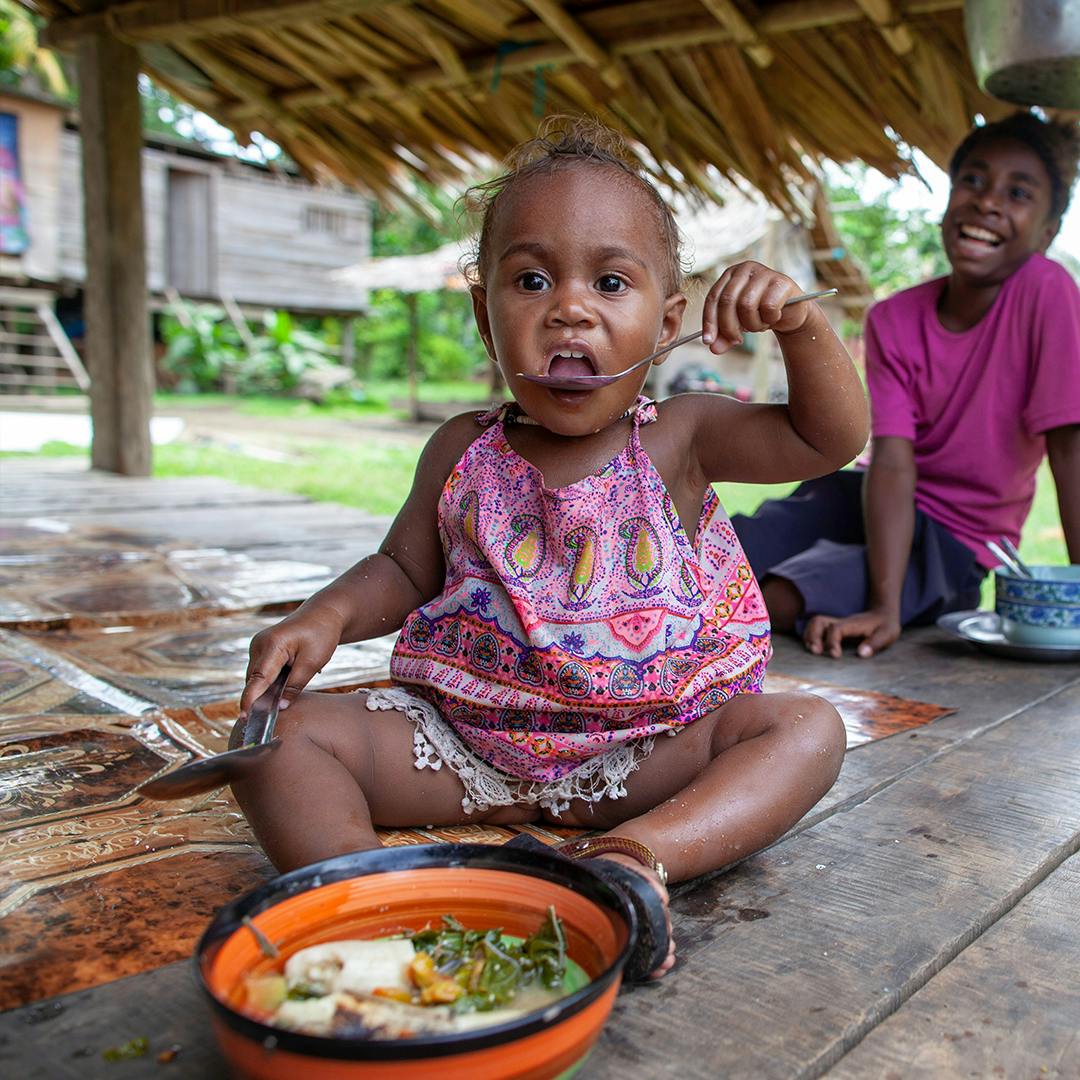 On 25 August, 2019, a girl eats vegetable broth in Guadalcanal, Solomon Islands.