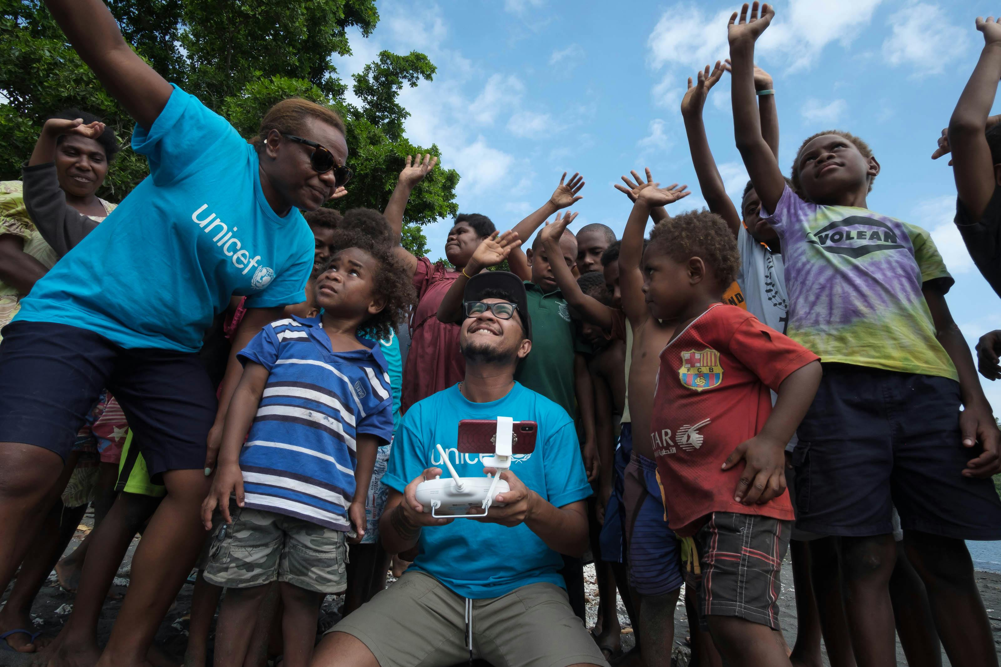 Joseph Hing and Rebecca Olul introducing the children of Epi to the magic of drones and how they will be part of a world first drone delivery of vaccines trial to be held in Vanuatu.