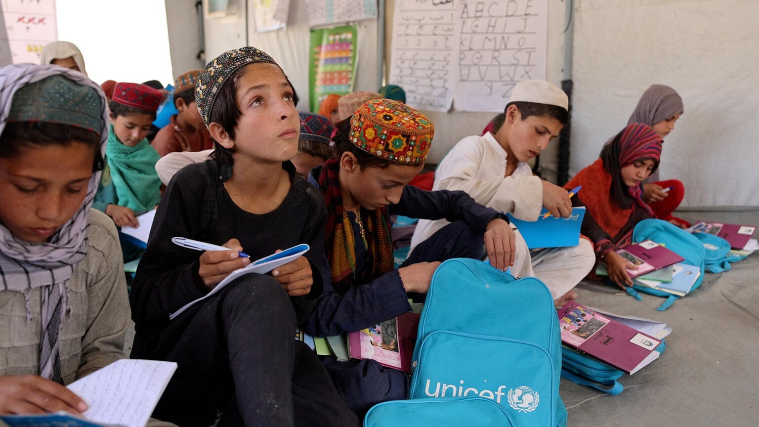 Building back better after emergency strikes - children learning in community education classes.