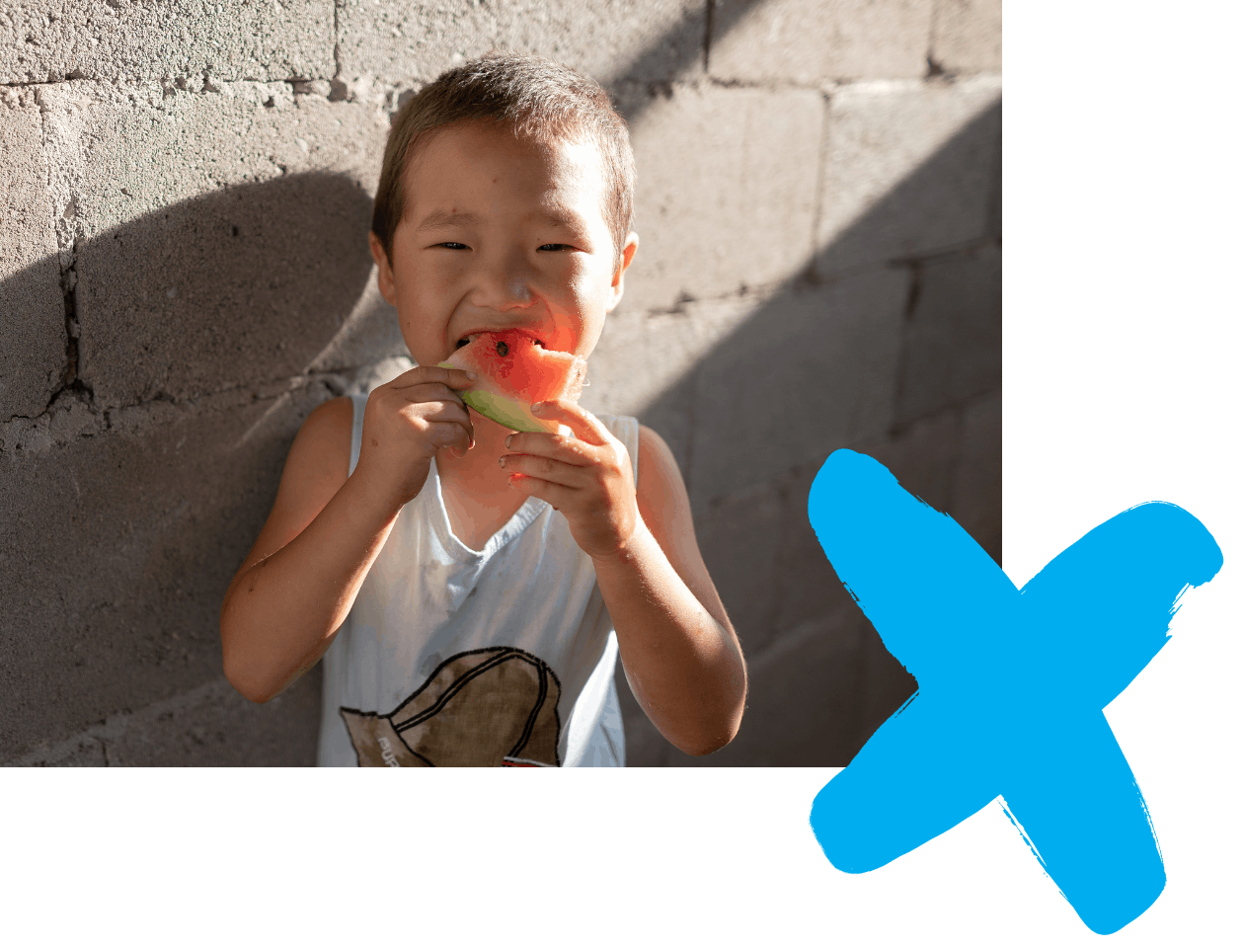 UNICEF Aotearoa nutrition - Young smiling child eating watermelon