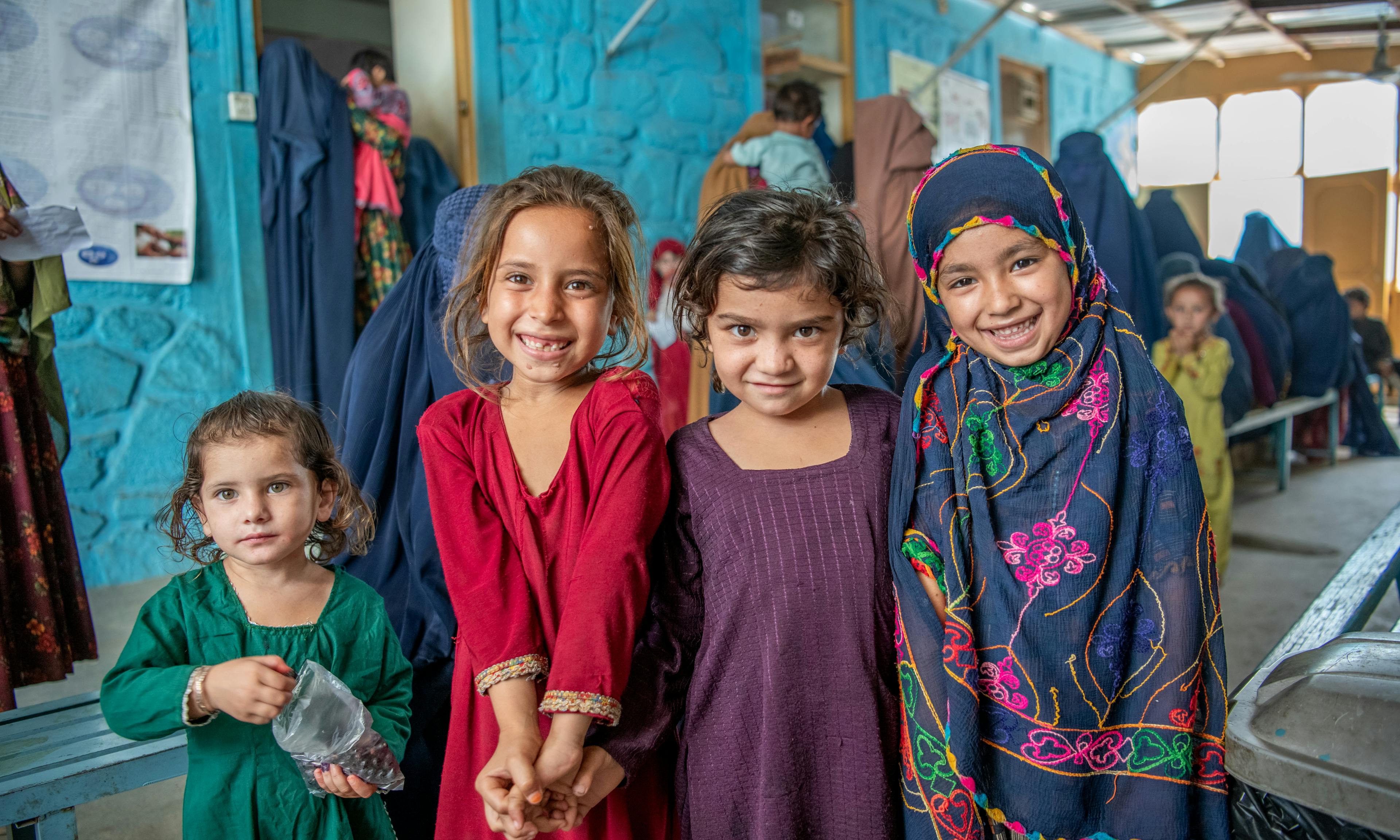 On 26 June 2023, children wait with their mothers in the crowded waiting area at the UNICEF supported Sawki District Hospital in Kunar Province, Afghanistan.