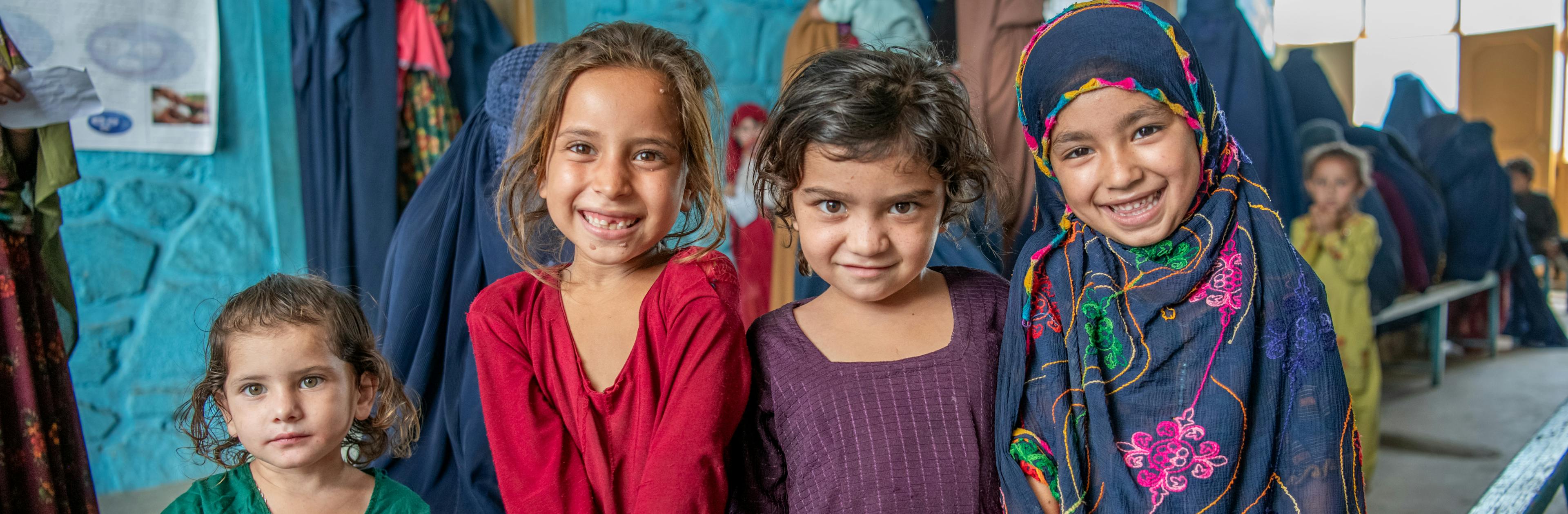 On 26 June 2023, children wait with their mothers in the crowded waiting area at the UNICEF supported Sawki District Hospital in Kunar Province, Afghanistan.